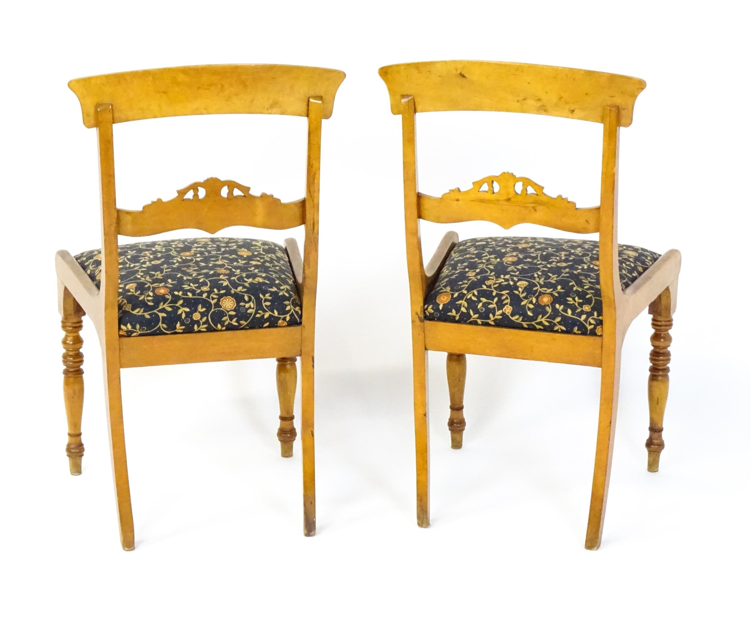 A pair of 19thC side chairs with bowed top rails, carved mid rails, drop in seats and raised on - Image 6 of 6