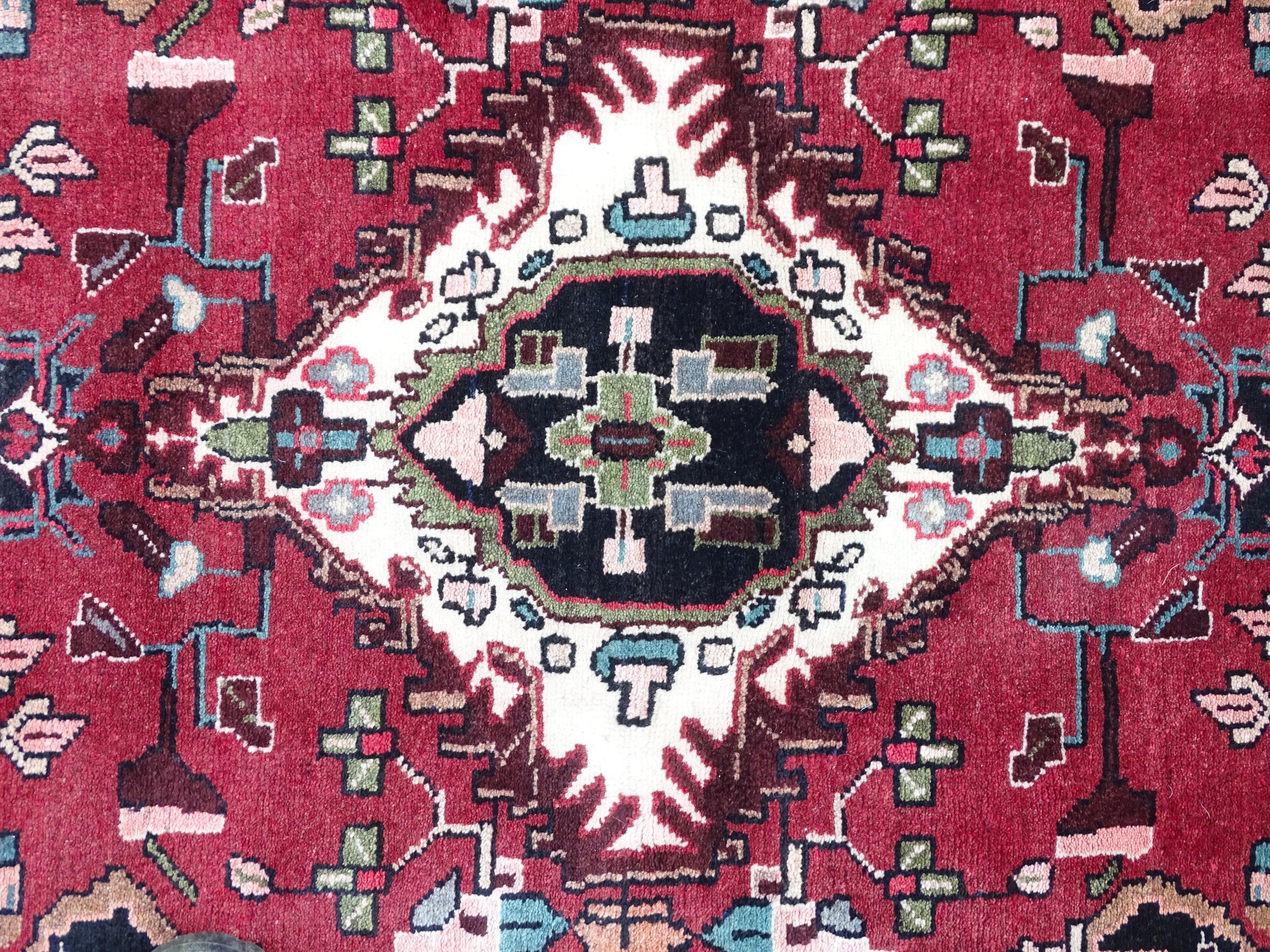 Carpet / Rug : A Persian Hamadan runner, the red ground with central cream ground medallion with - Image 8 of 8