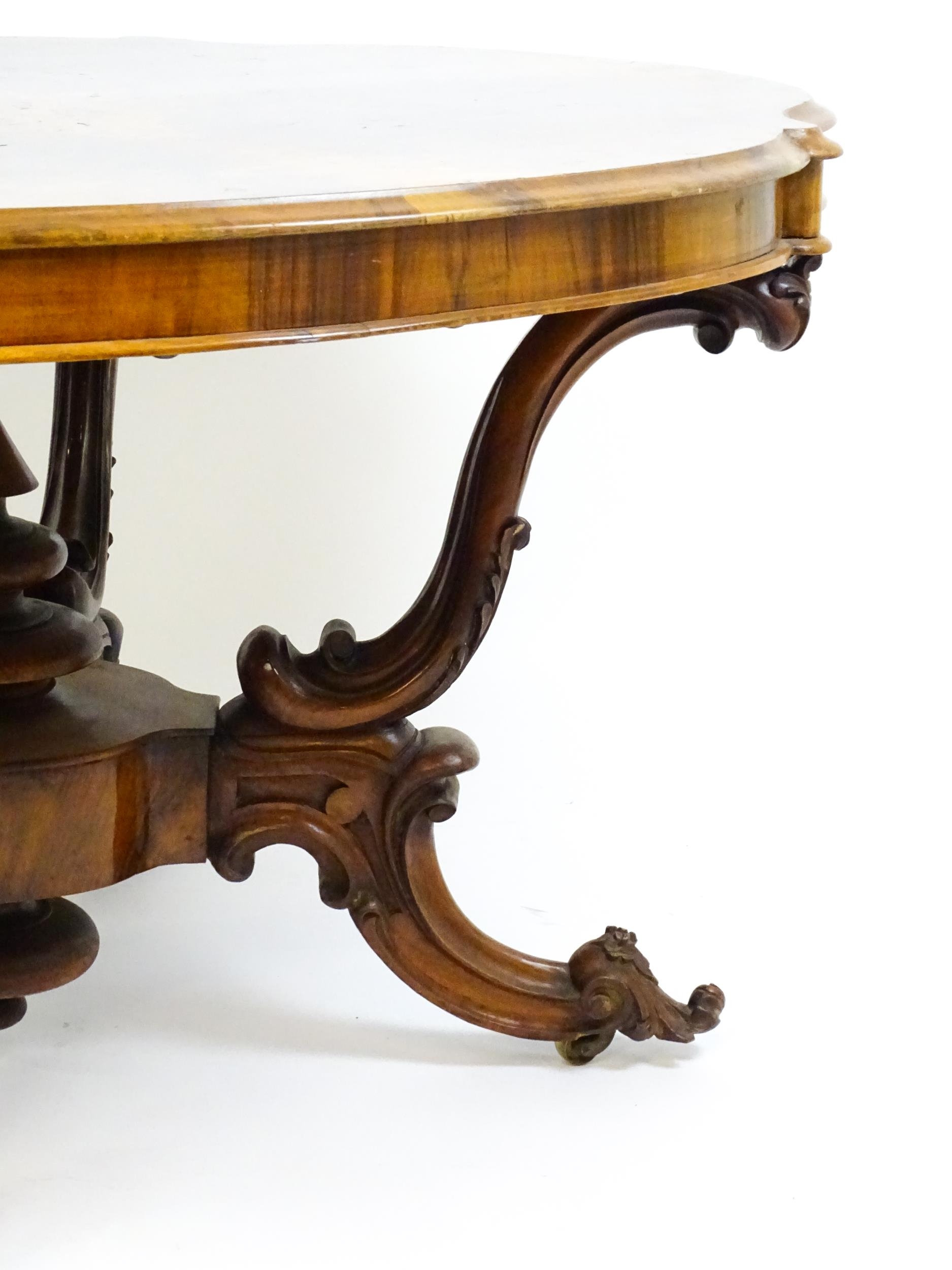 A 19thC burr walnut centre table with a moulded top above four acanthus carved supports, a large - Image 6 of 16