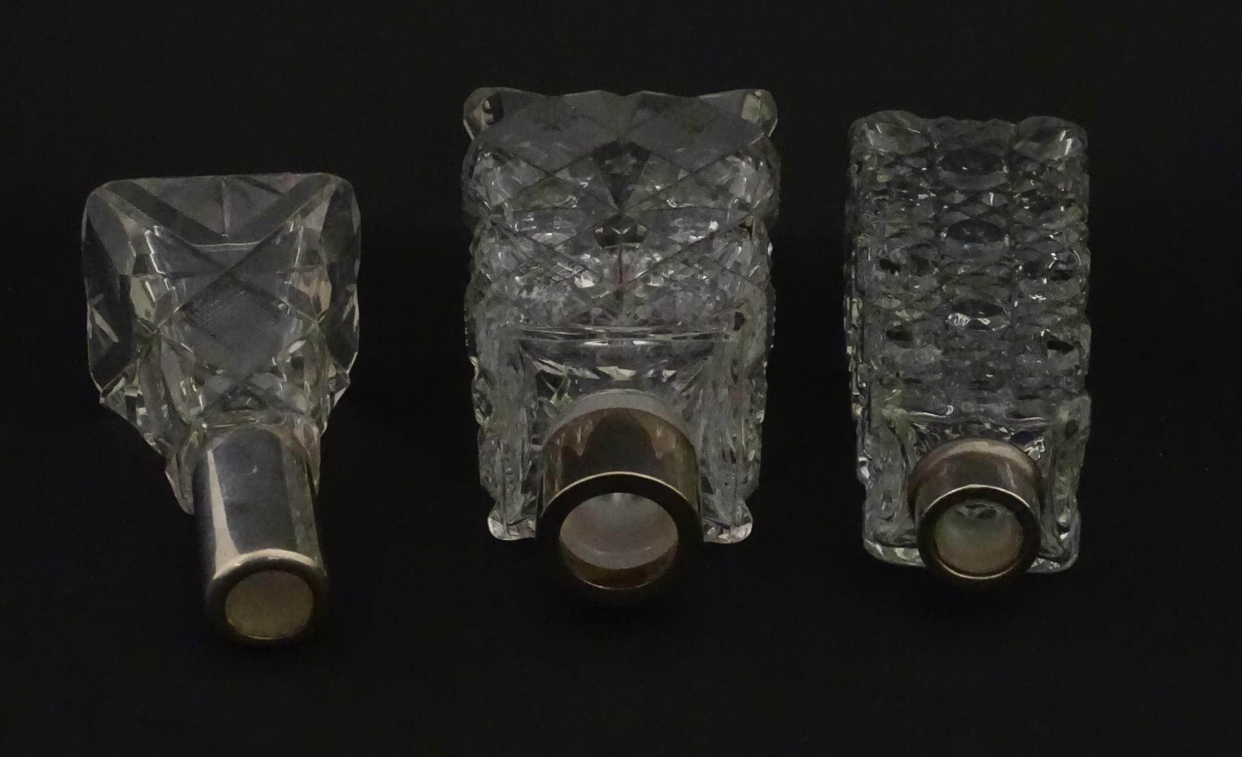 Three assorted cut glass scent / perfume bottles with silver mounts, to include one hallmarked - Image 2 of 10