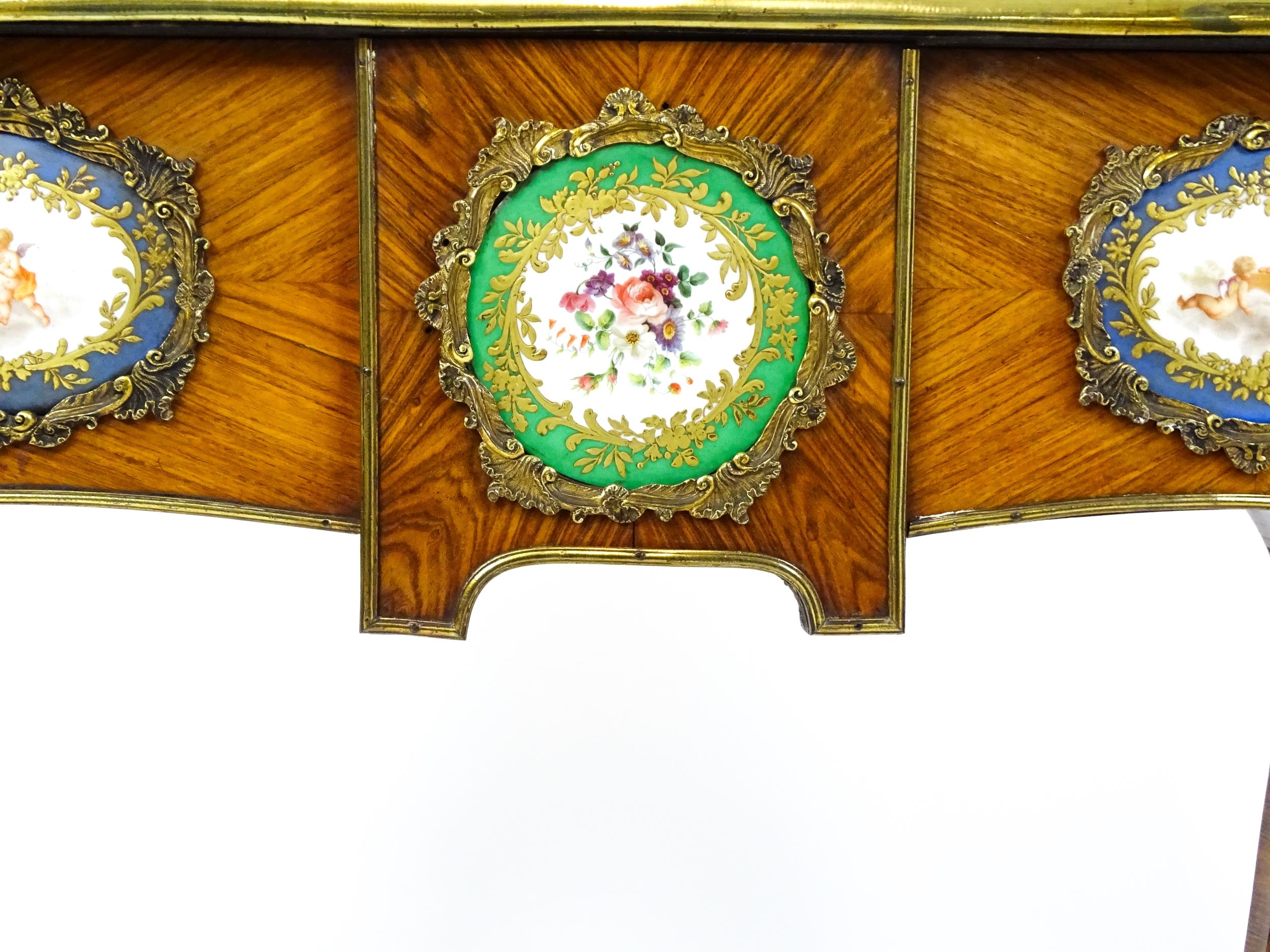A mid 19thC kingwood side table with a brass moulding to the top edge and three Sevres style plaques - Image 9 of 14