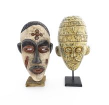 Ethnographic / Native / Tribal: Two African carved wooden masks with carved decoration, on with