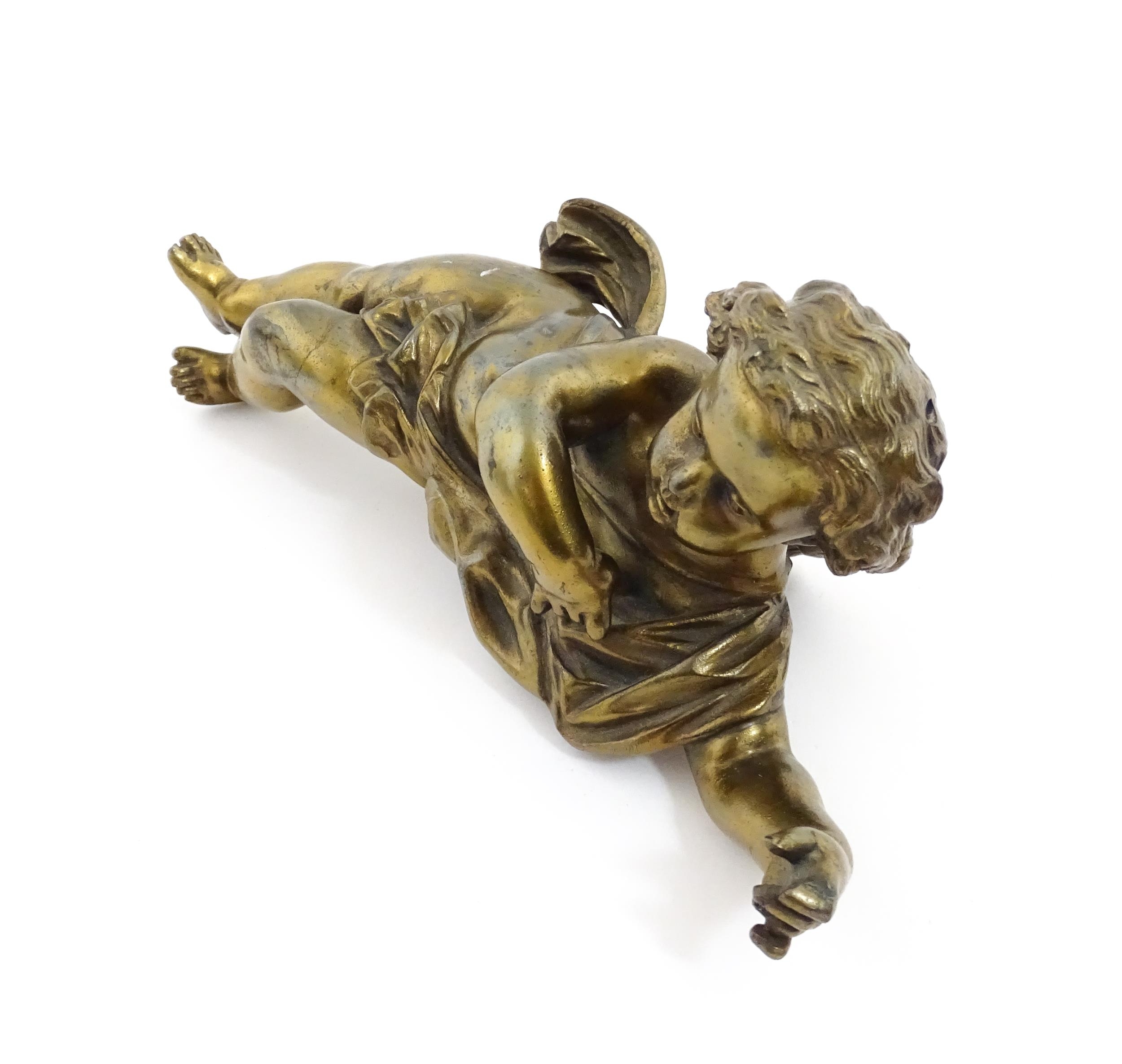 A 20thC cast model of a winged putto / cherub. Approx. 11" long Please Note - we do not make - Image 4 of 6