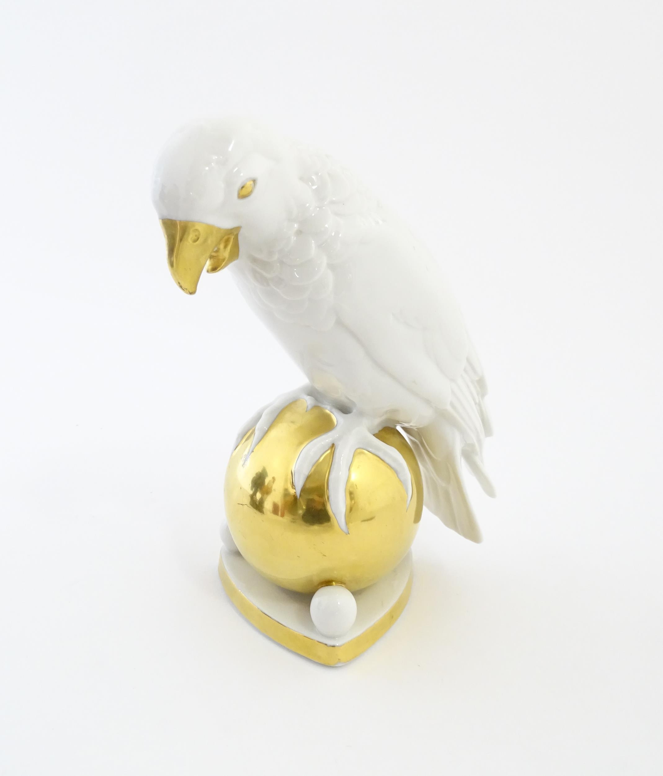 A Hutschenreuther model of a parrot perched upon a gilt ball. Marked under. Approx. 8 1/4" high - Image 4 of 8