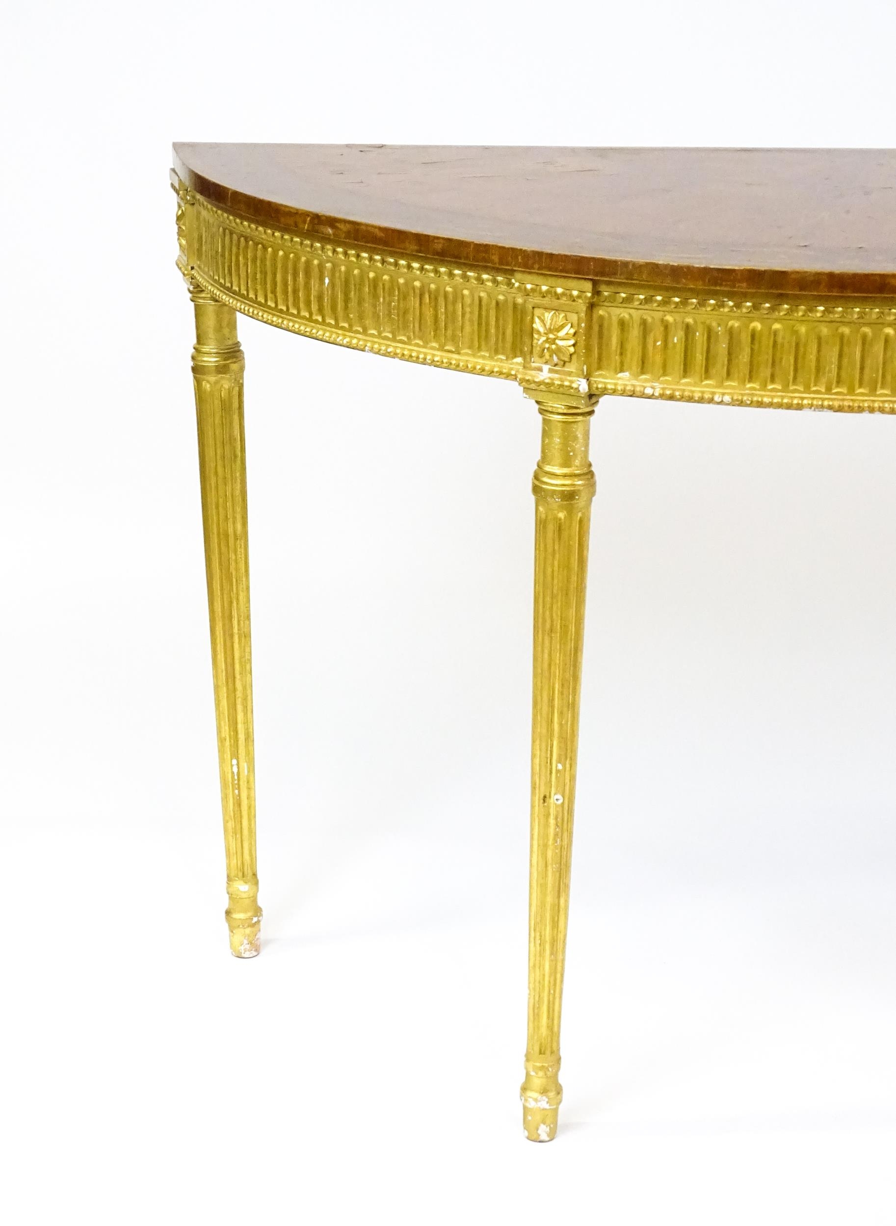 A demi lune console table with a marquetry inlaid top above a fluted frieze and moulded floral - Image 3 of 11