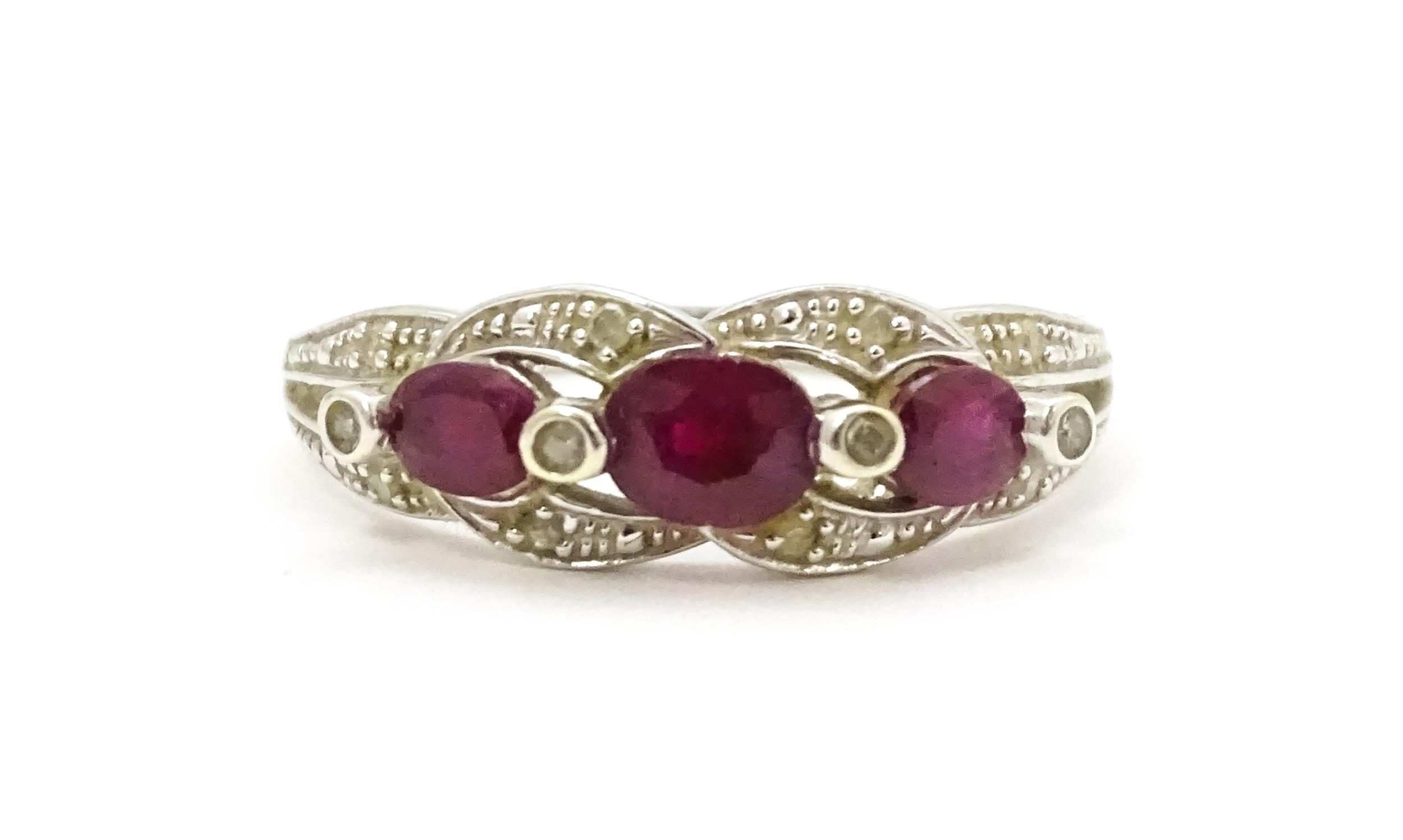 A 9ct white gold ring set with rubies and diamond. Ring size approx. M 1/2 Please Note - we do not - Image 3 of 7