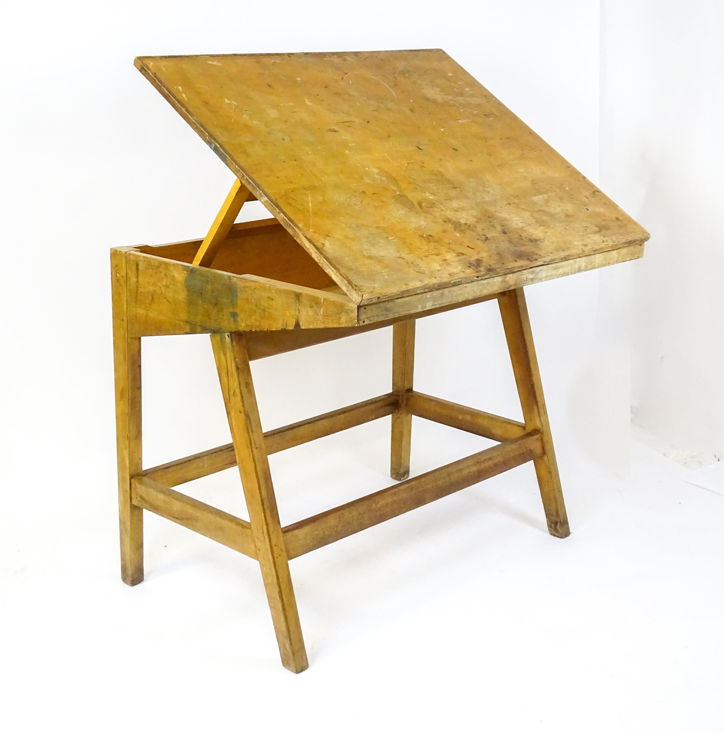 A mid / late 20thC artists desk with a hinged, adjustable top raised on tapering legs united by a - Image 7 of 11