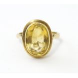 A 9ct gold ring set with central citrine. Ring size approx. O Please Note - we do not make reference