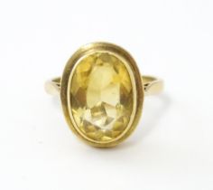 A 9ct gold ring set with central citrine. Ring size approx. O Please Note - we do not make reference