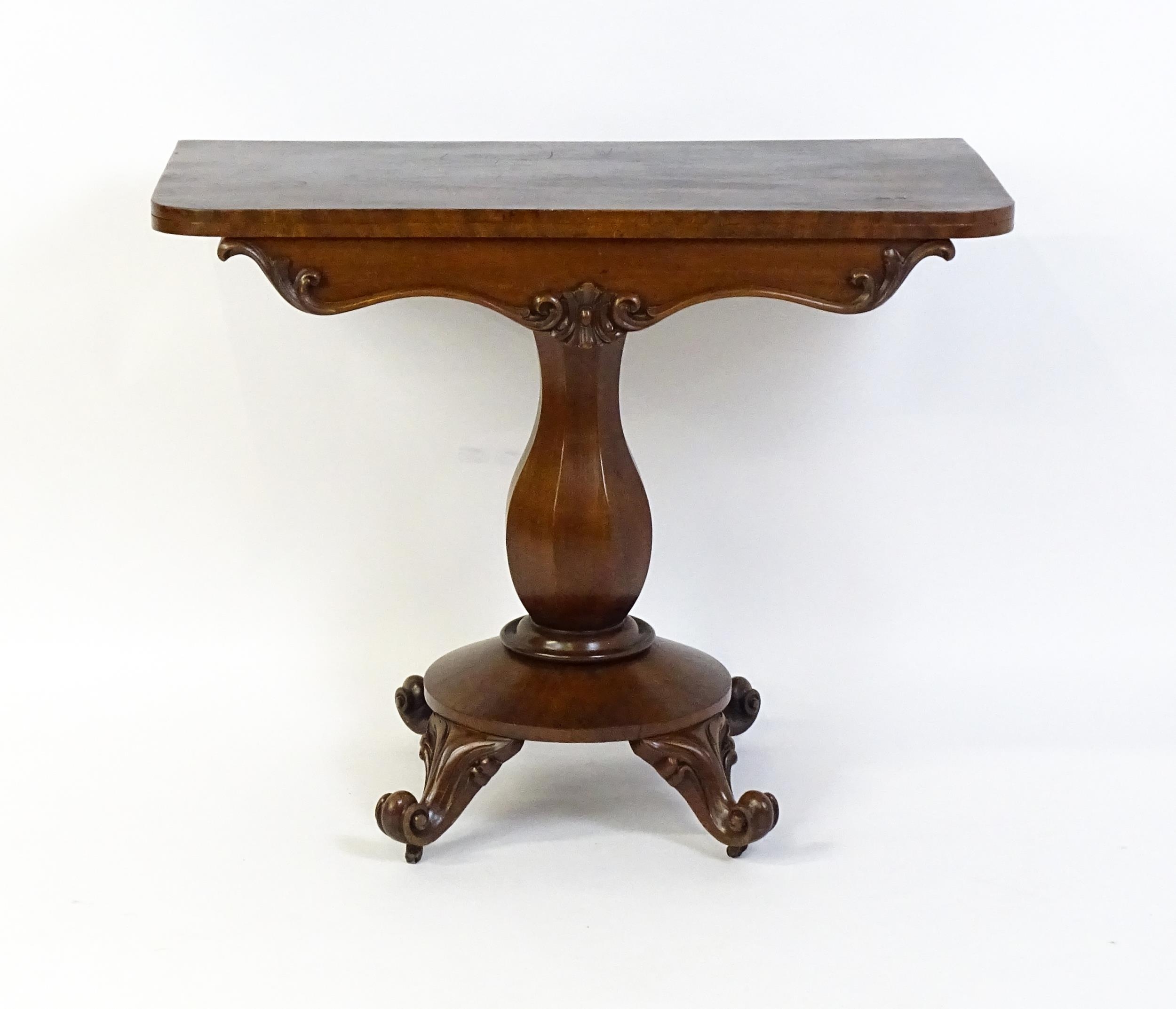 A 19thC mahogany tea table with a carved floral front panel above a canted and shaped pedestal above - Image 3 of 4