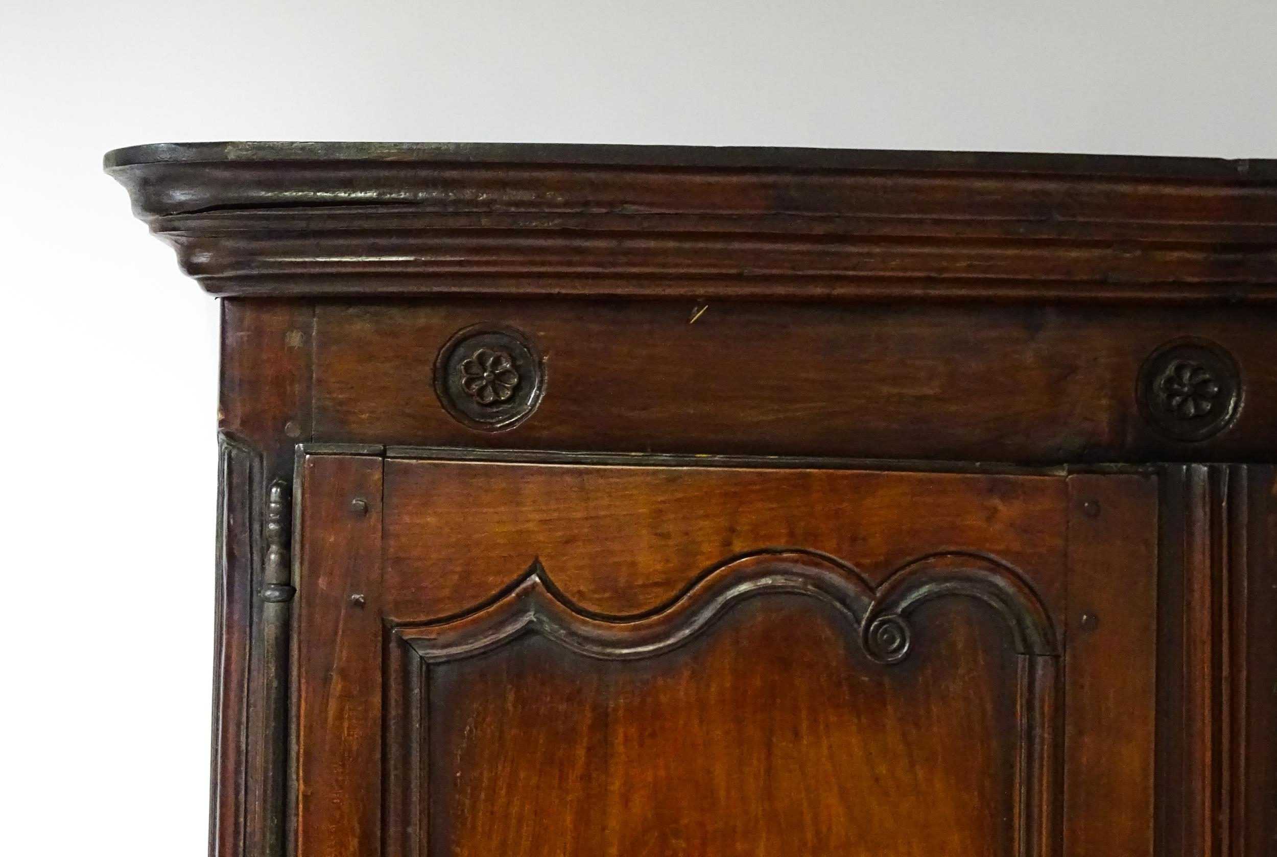 An 18thC French buffet deux corps with a moulded pediment above a floral carved frieze. The top - Image 3 of 10