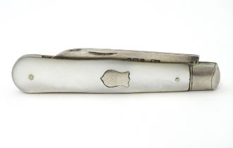 A silver folding fruit knife with mother of pearl handle hallmarked Sheffield 1906, maker William