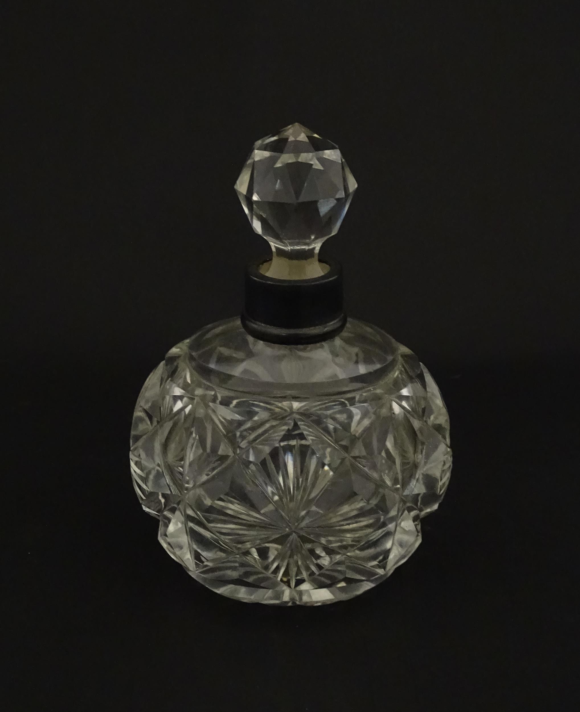 A cut glass scent / perfume bottle with silver top hallmarked London C.1933 . Approx. 5 1/4" high - Image 5 of 8