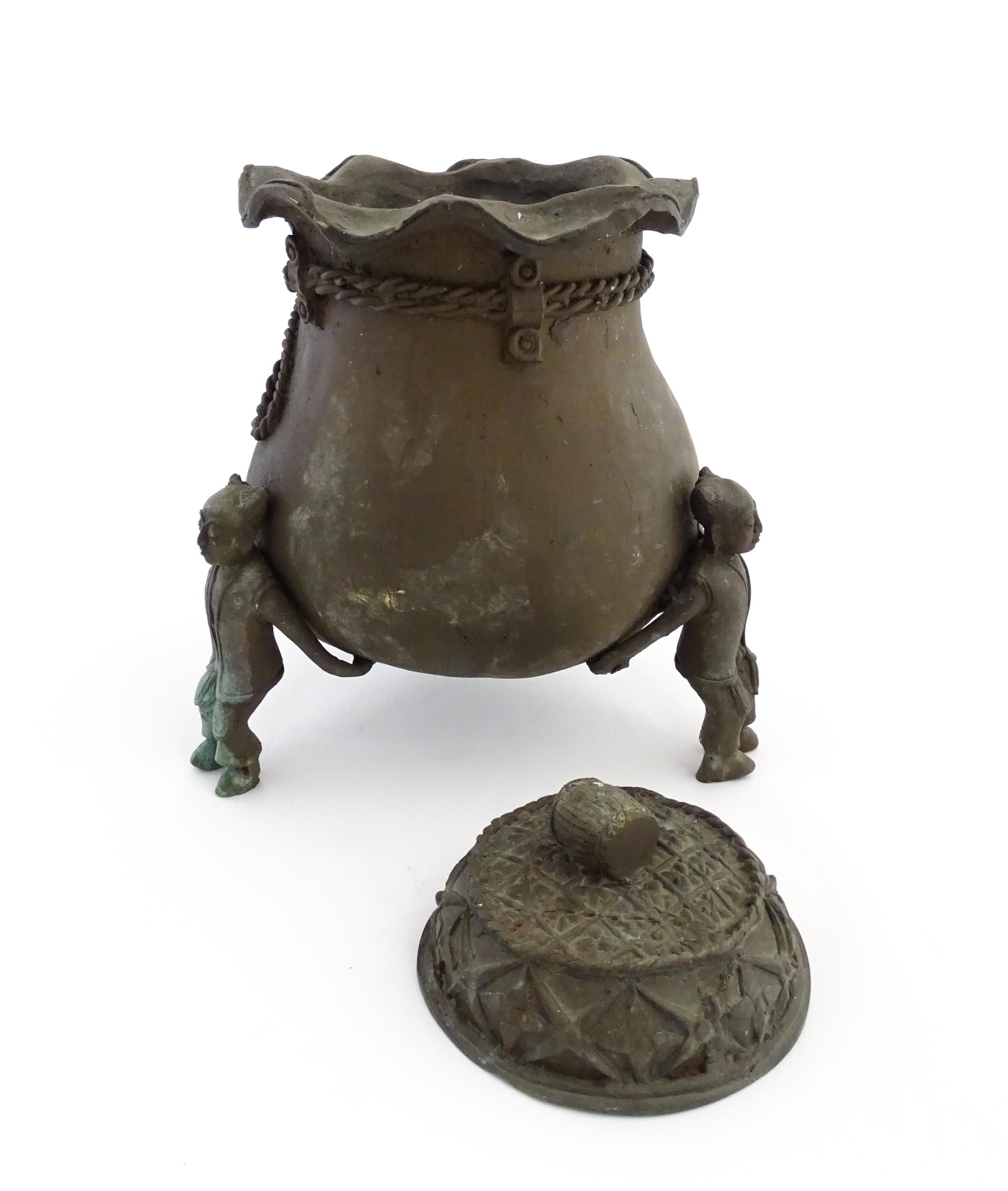A Chinese cast bronze pot and cover modelled as a money bag with rope tie supported by three figural - Image 3 of 10