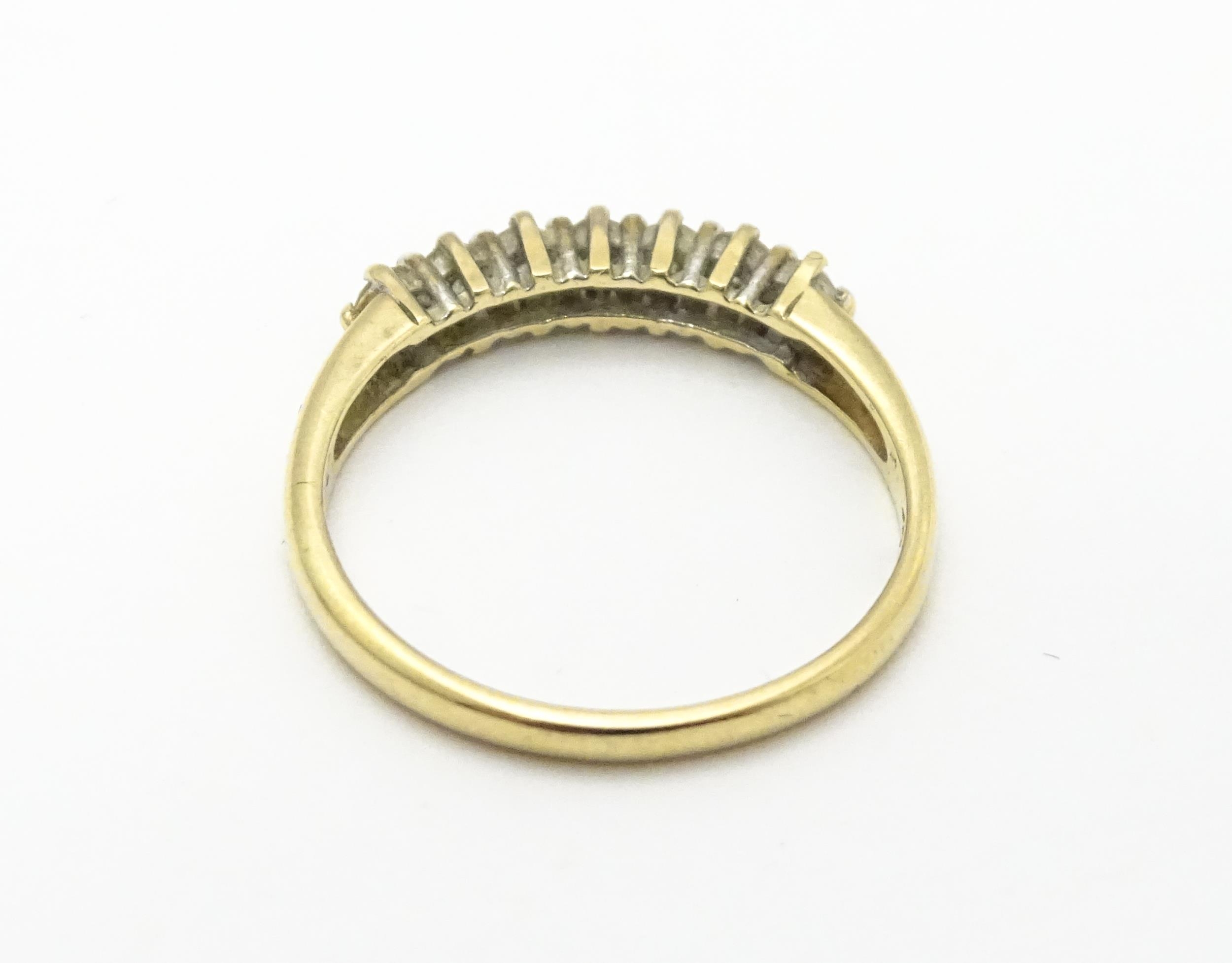 A 9ct gold ring set with seven diamonds in a linear setting. Ring size approx. K 1/2 Please Note - - Image 6 of 7