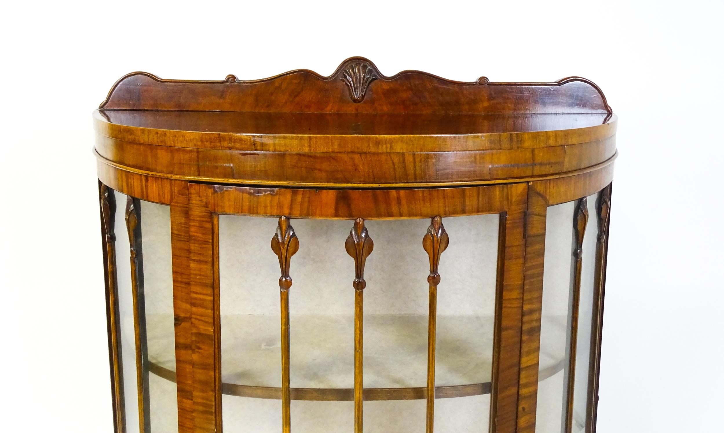 An early / mid 20thC walnut demi lune display cabinet with a shaped and carved upstand above a - Image 7 of 8