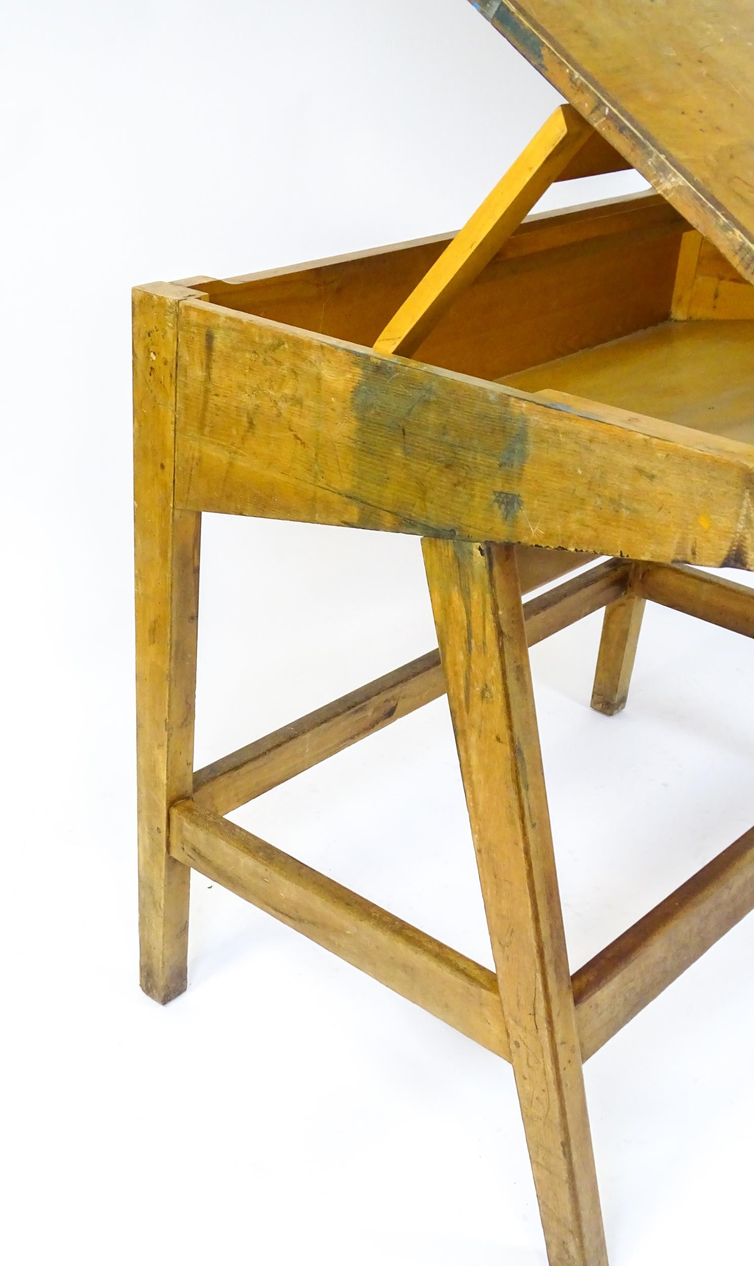 A mid / late 20thC artists desk with a hinged, adjustable top raised on tapering legs united by a - Image 8 of 11