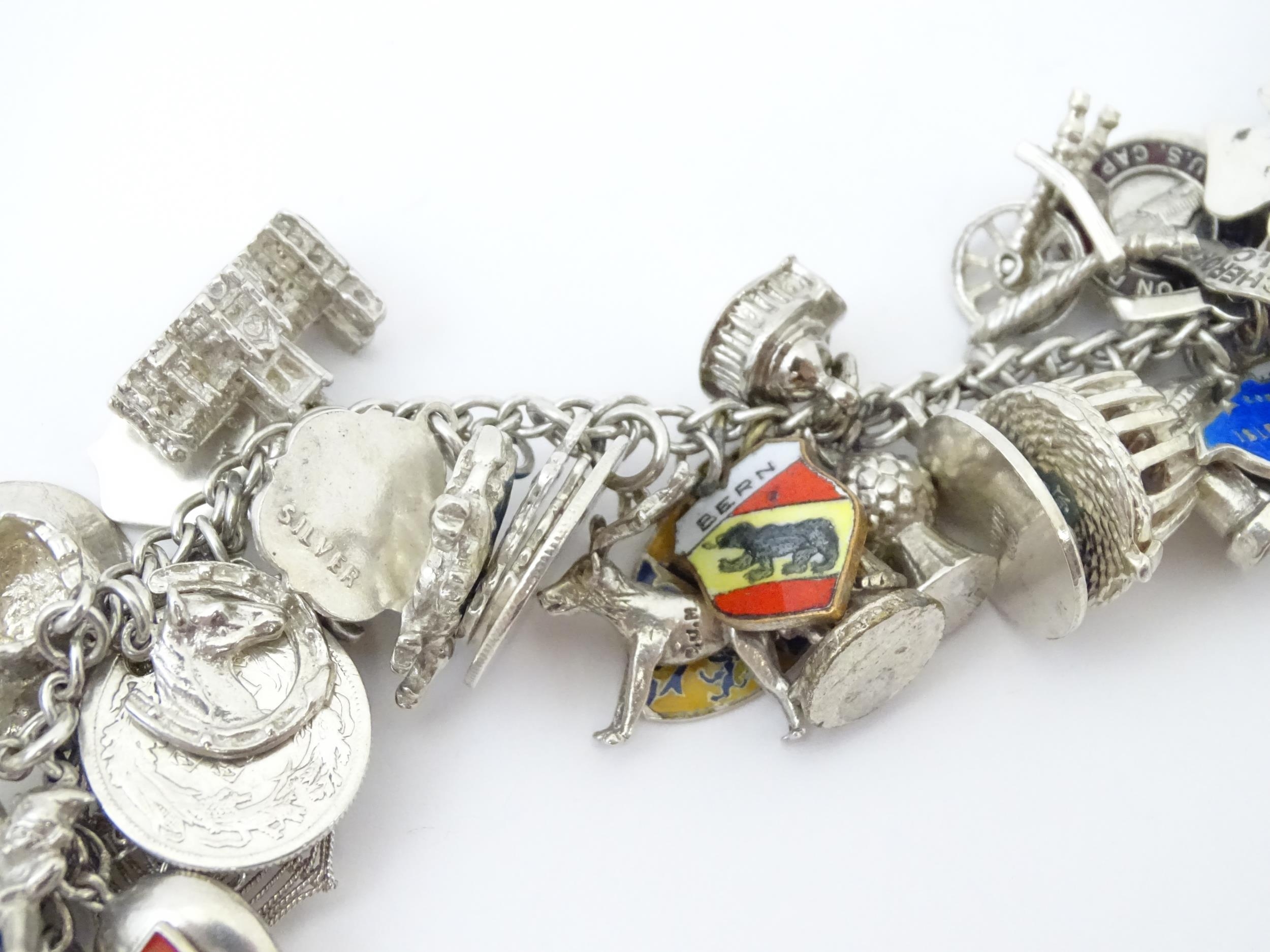 A silver charm bracelet set with various silver, white metal and silver plate charms Please Note - - Image 6 of 8