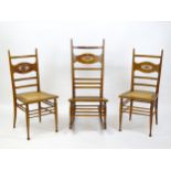 A group of three early 20thC Arts and Crafts style chairs comprising a rocking chair and two side