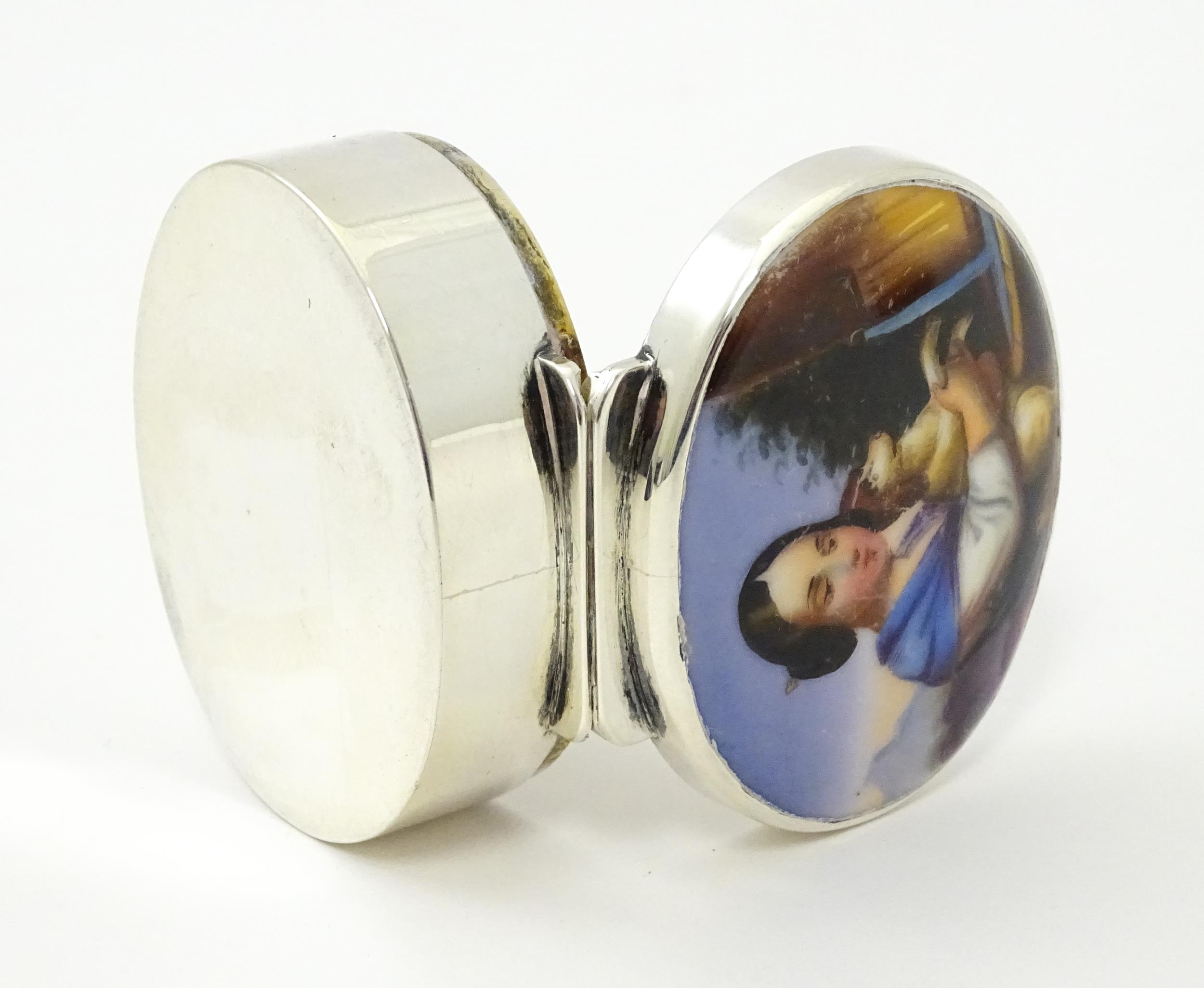 A silver pill box with gilded interior and ceramic cabochon to lid depicting a young girl holding - Image 7 of 9