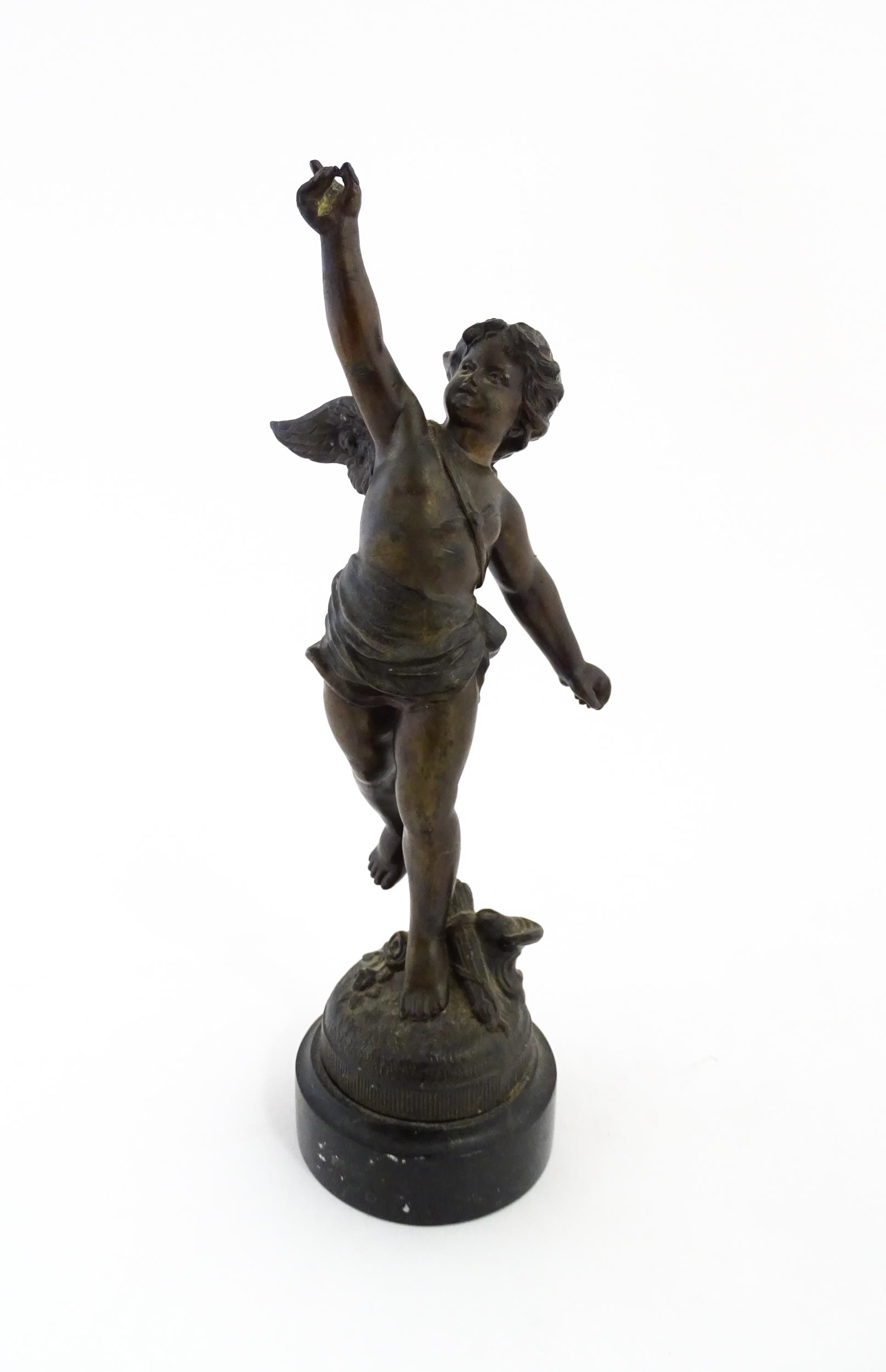 A 20thC cast model of Cupid in the manner of Jean-Louis Gregoire. Approx. 12 1/2" high Please Note -