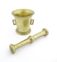 A 19thC brass pestle and mortar, the mortar of tapering form with twin rectangular handles. Mortar