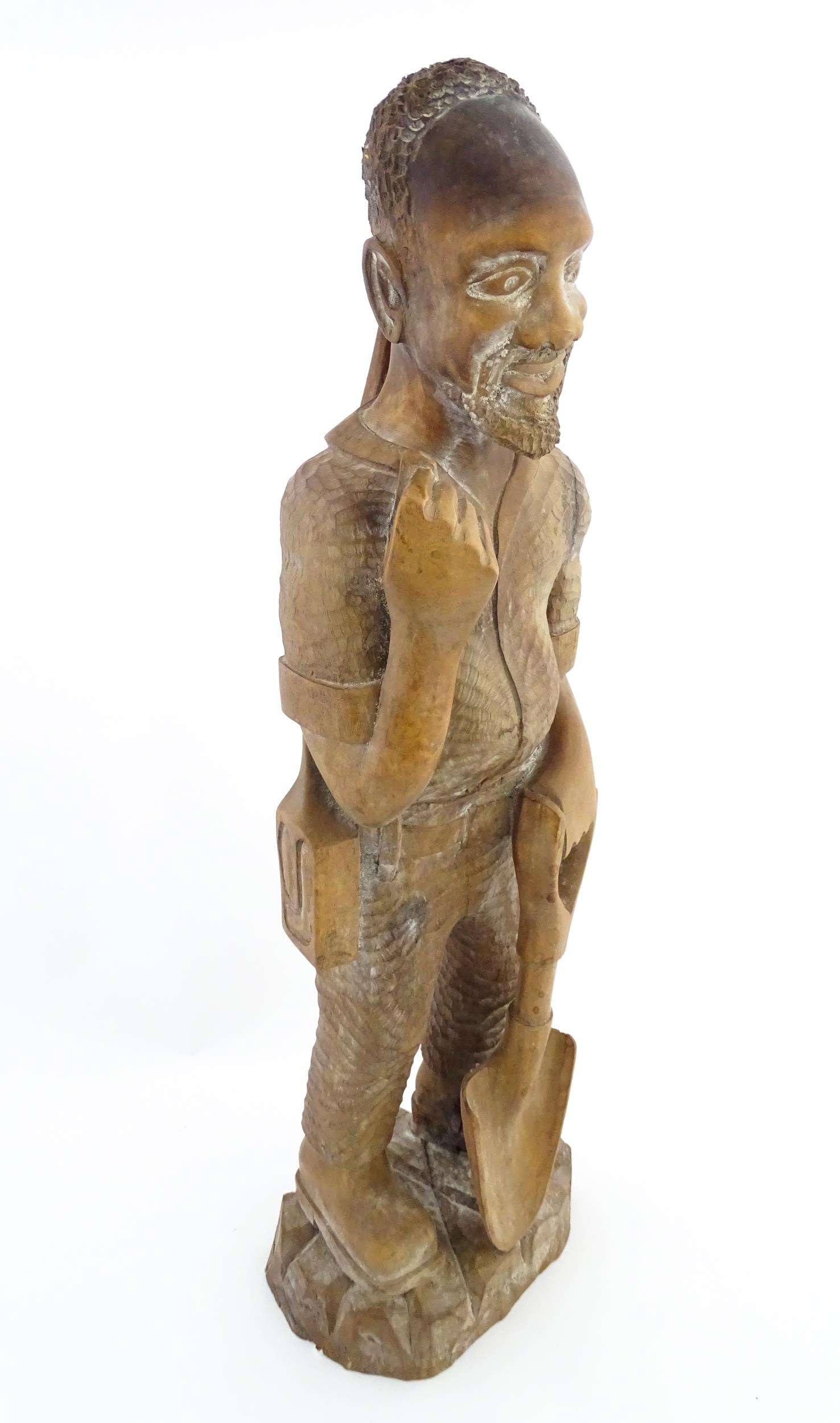 Ethnographic / Native / Tribal: An African carved wood figure modelled as a male farmer with a - Image 3 of 8