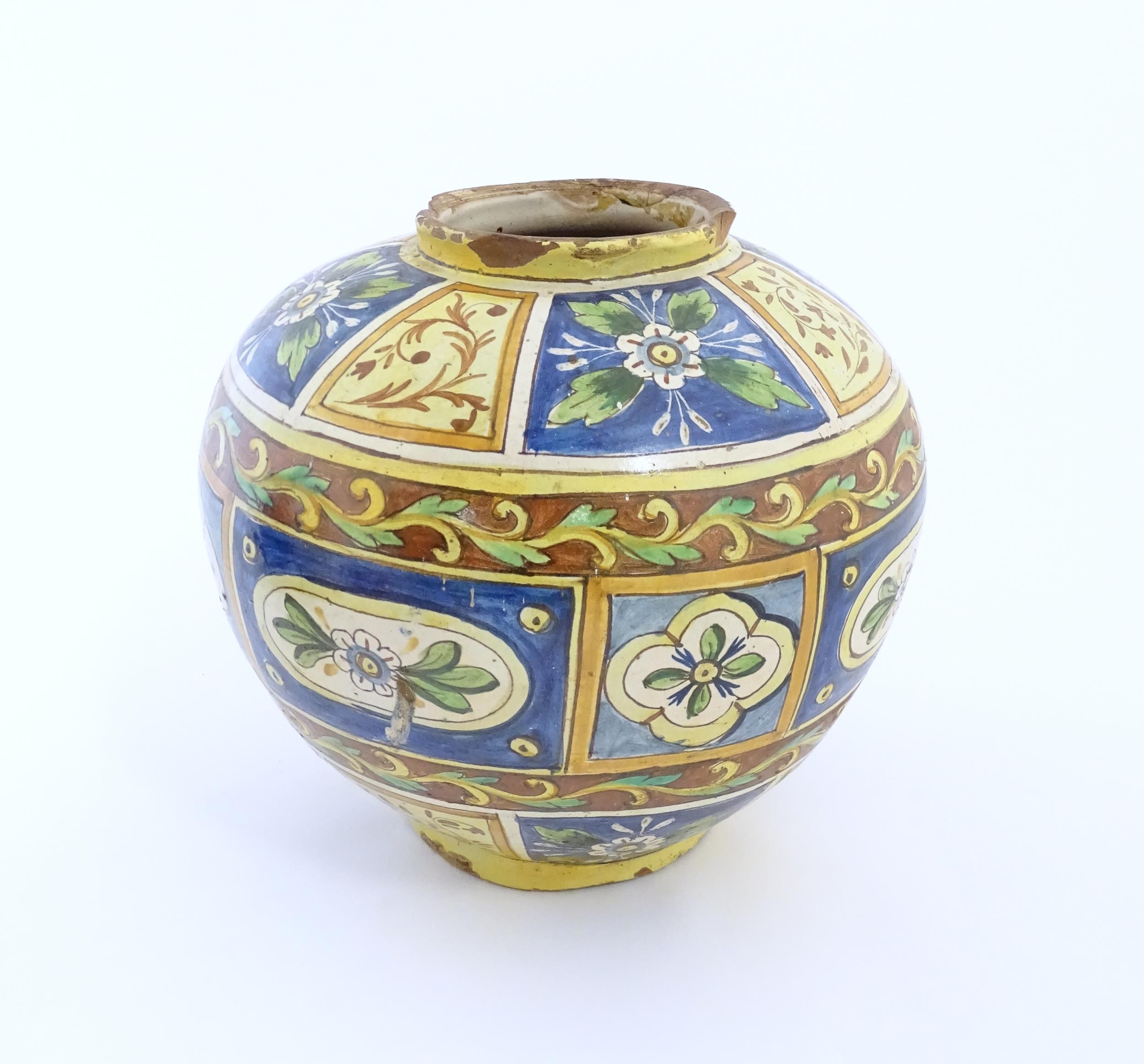 A Sicilian maiolica Bombola vase with panelled and banded decoration depicting flowers and - Image 9 of 10