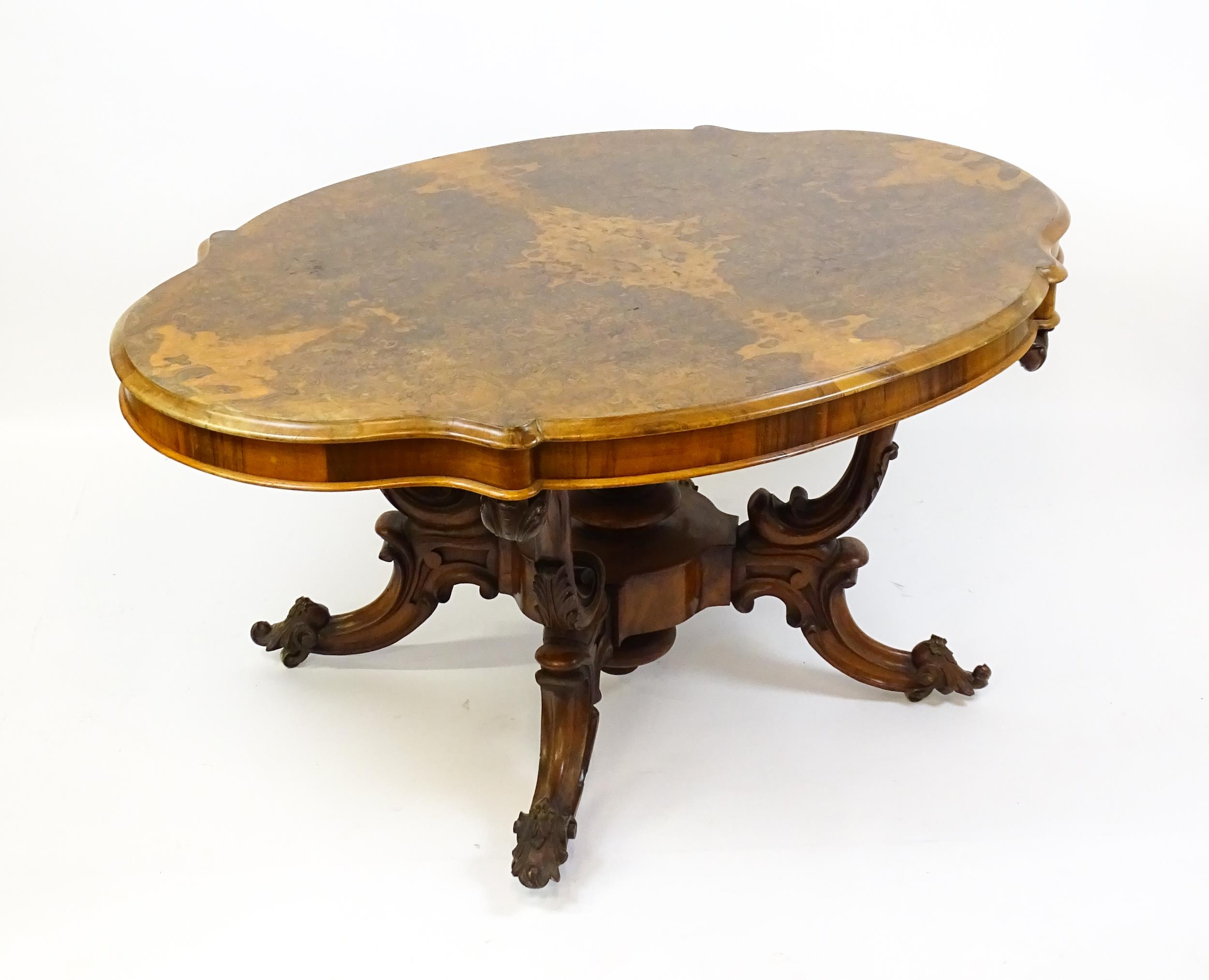 A 19thC burr walnut centre table with a moulded top above four acanthus carved supports, a large - Image 3 of 16