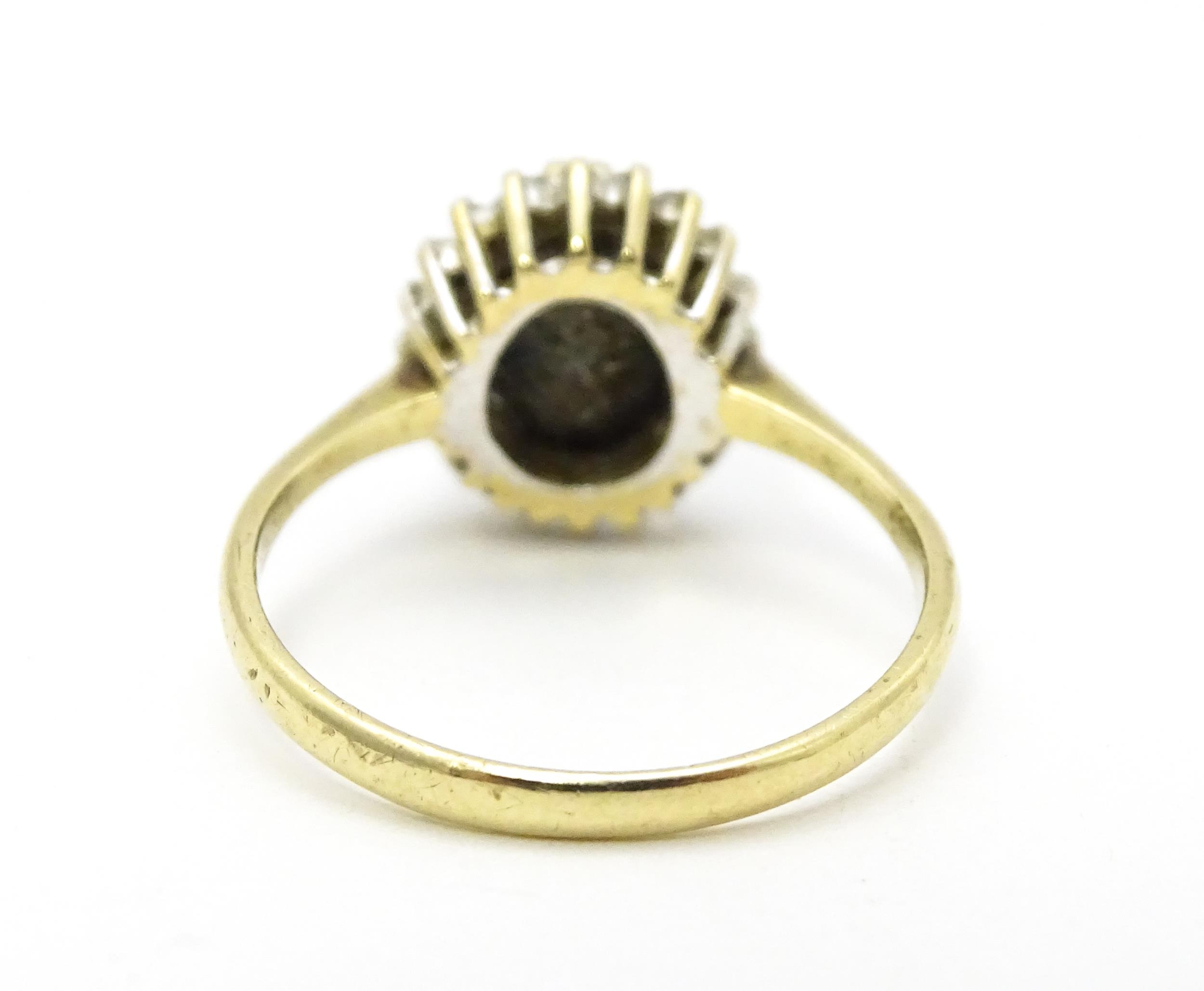 A 9ct gold ring set with central sapphire bordered by diamonds. Ring size approx. P Please Note - we - Image 6 of 6