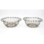 A pair of 19thC wirework planters / baskets with scrolling detail. Each approx. 24" in diameter x 8"