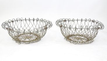 A pair of 19thC wirework planters / baskets with scrolling detail. Each approx. 24" in diameter x 8"