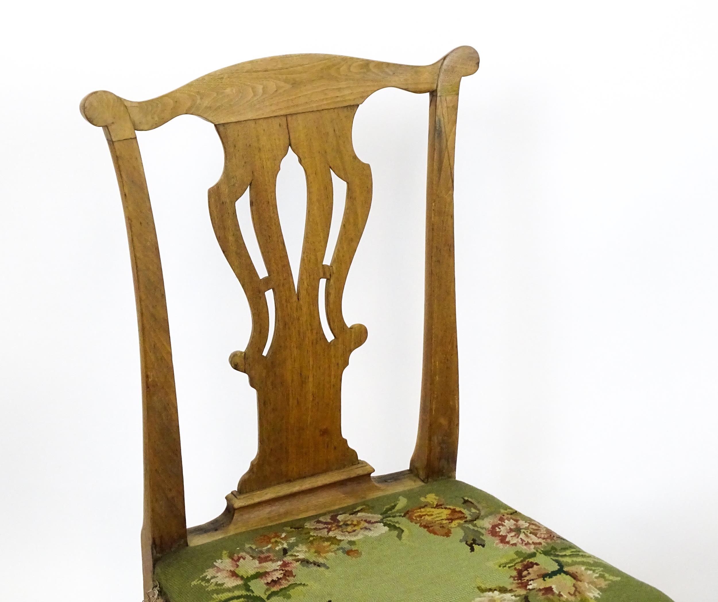 A pair of George II walnut side chairs with shaped top rails above pierced splats and raised on - Image 3 of 7