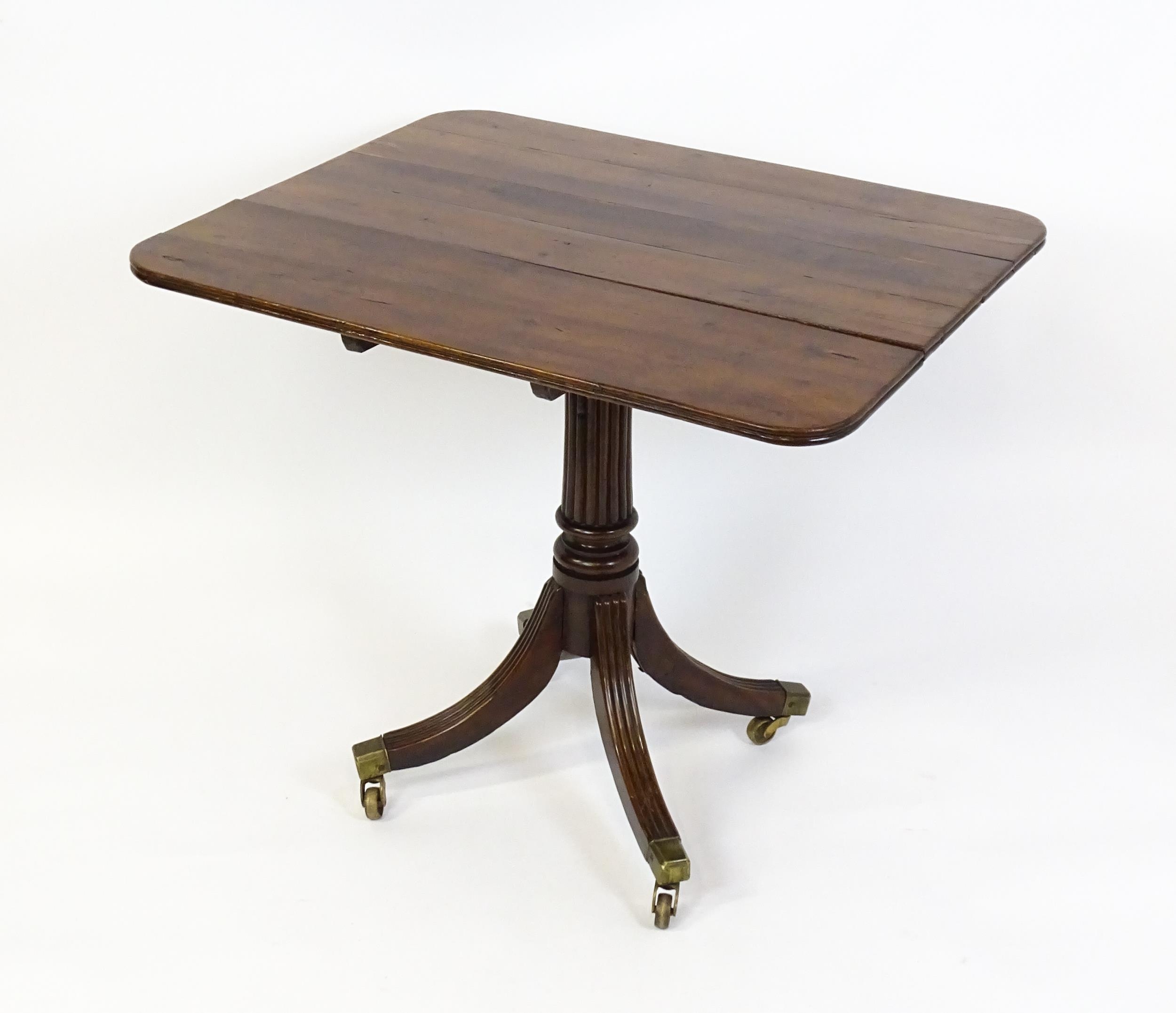 A 19thC tilt top occasional table with yew wood planked top above a reeded mahogany pedestal and - Image 12 of 13