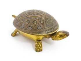 A 20thC novelty clockwork counter bell modelled as a tortoise, the shell with Damascene style