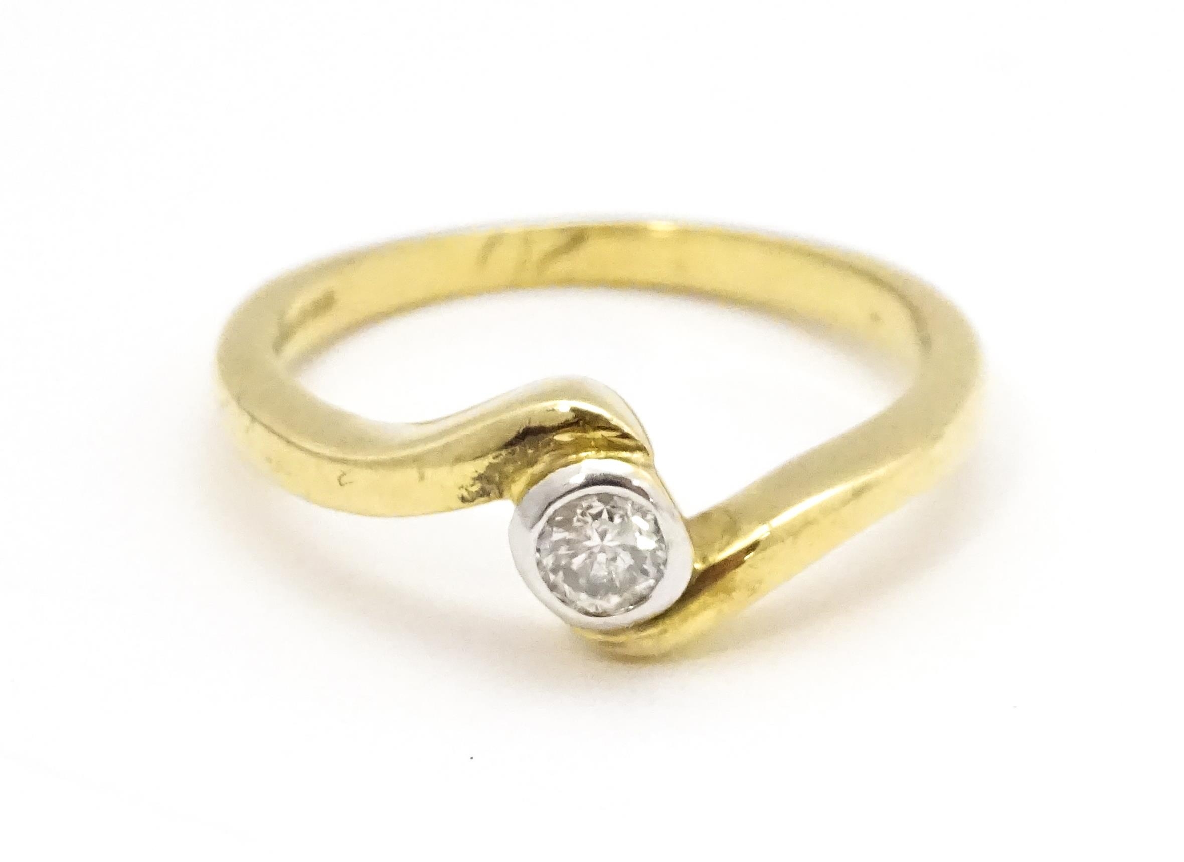 A 9ct gold ring set with central diamond. Ring size approx. O 1/2 Please Note - we do not make