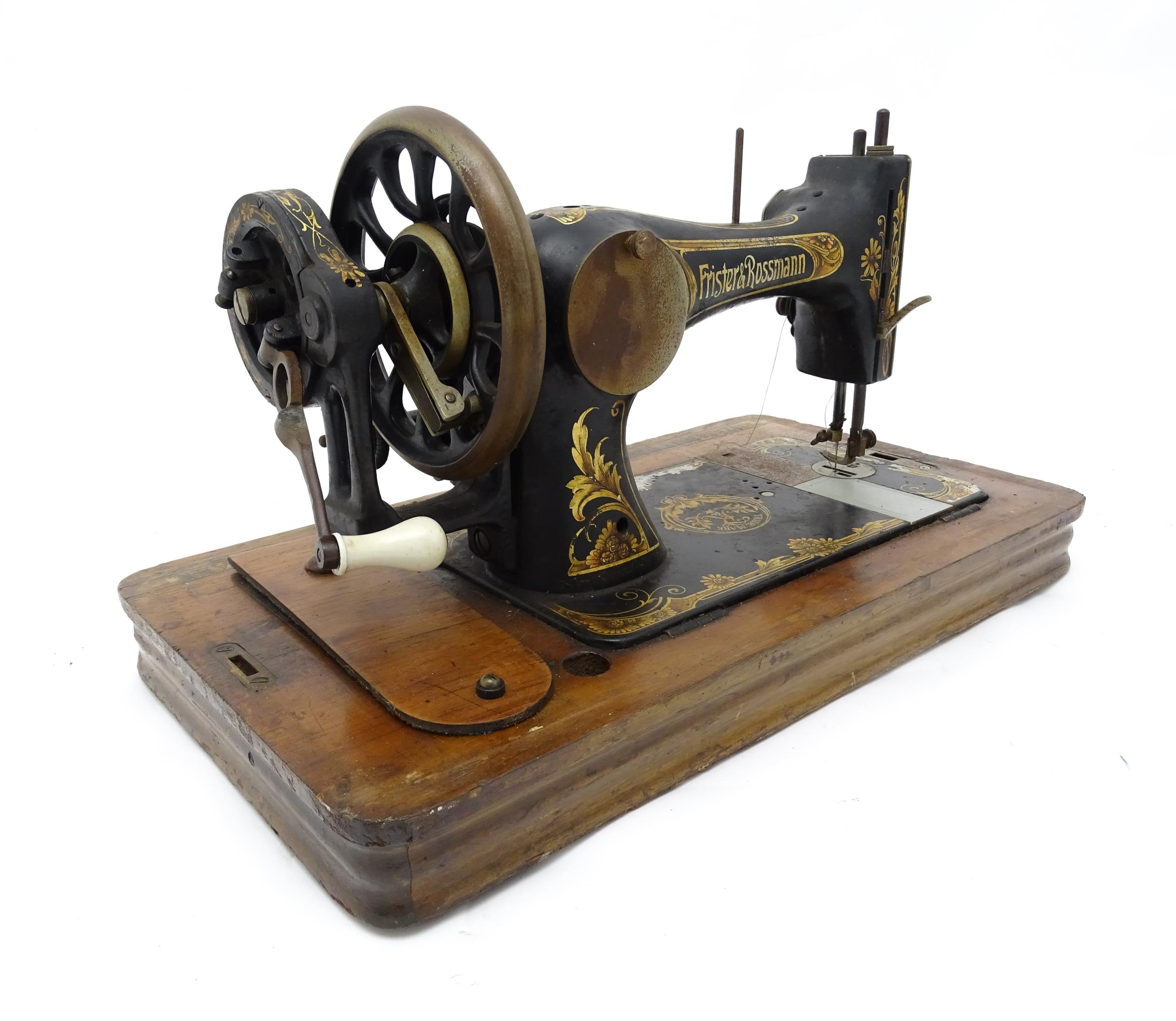 An early 20thC Frister & Rossmann hand crank sewing machine with floral and foliate decoration. - Image 5 of 15