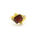 A 9ct gold ring set with central garnet. Ring size approx. O 1/2 Please Note - we do not make