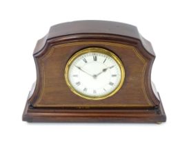 An early 20thC French mahogany cased mantle clock with white enamel dial and movement by