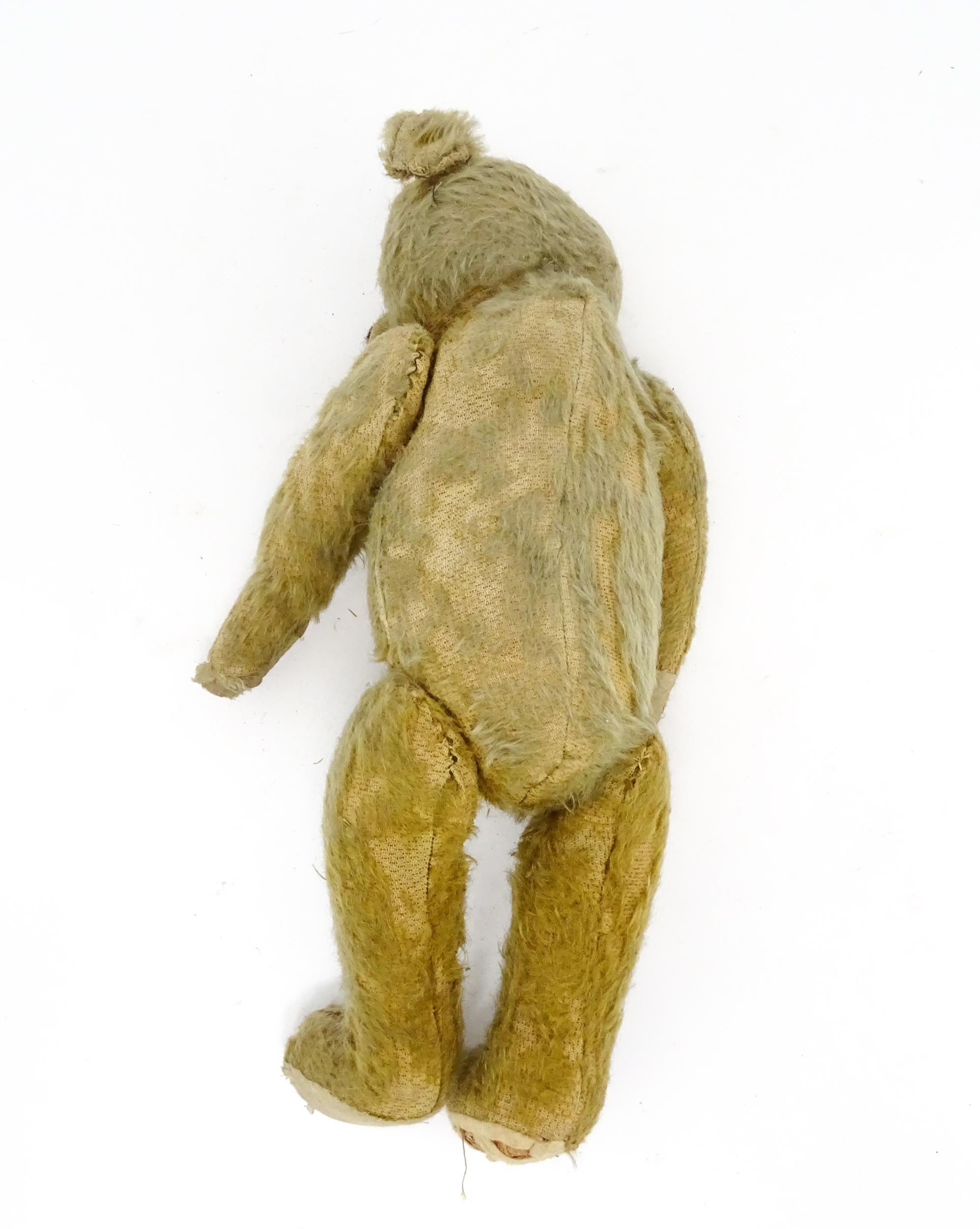 Toy: An early 20thC mohair straw filled teddy bear with proud nose, stitched mouth, hump back, - Image 4 of 9