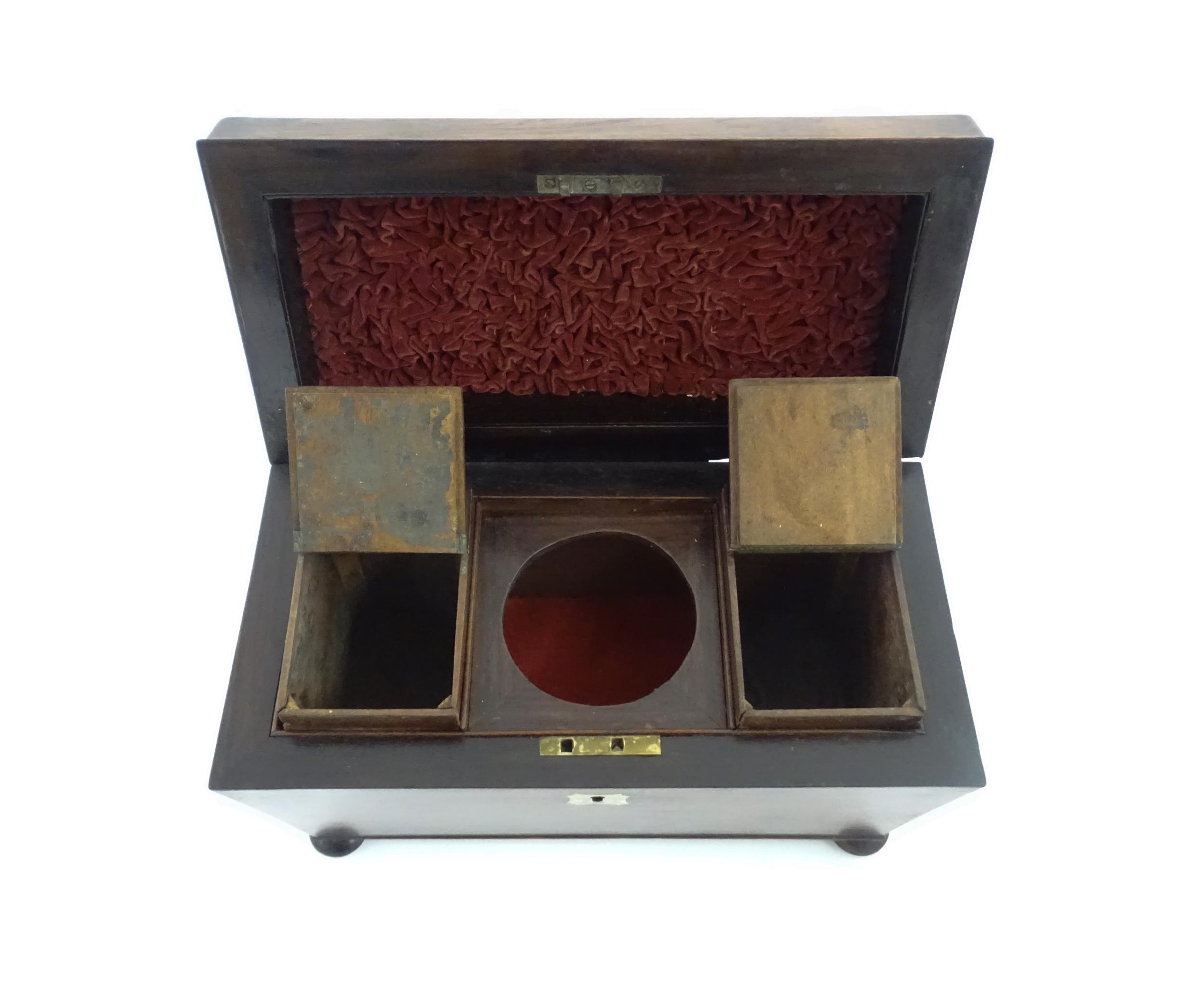 A 19thC rosewood tea caddy of sarcophagus form with four squat bun feet. The interior with two - Image 11 of 15