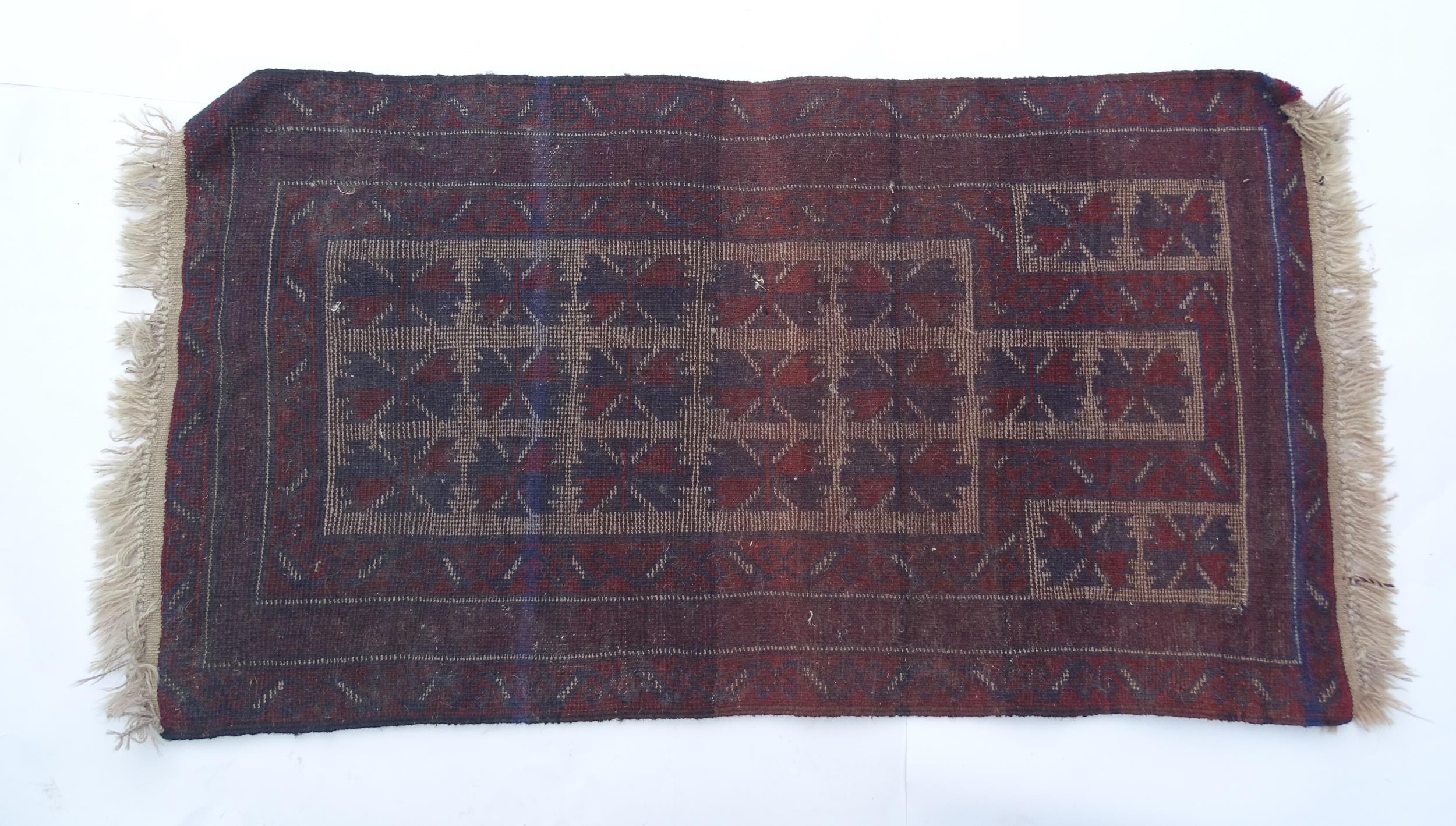 Carpet / Rug : A red, blue and cream ground rug with repeating geometric motifs. Approx. 55" x 29" - Image 2 of 7