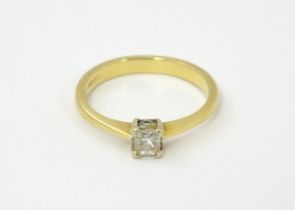 An 18ct gold ring set with diamond solitaire. Ring size approx. L 1/2 Please Note - we do not make