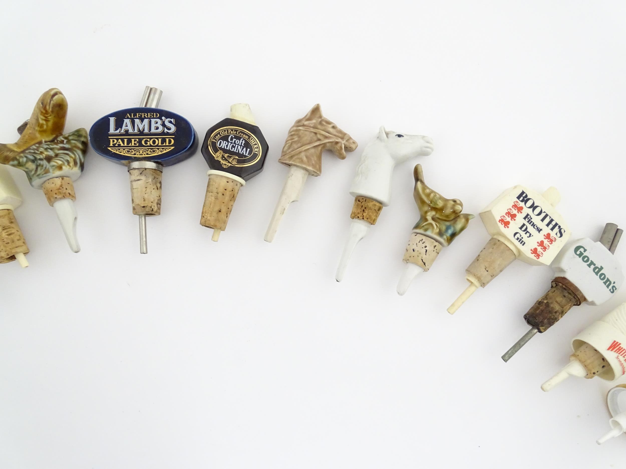 Breweriana : A quantity of assorted 20thC advertising bottle stoppers / pourers to include Booth's - Image 7 of 16