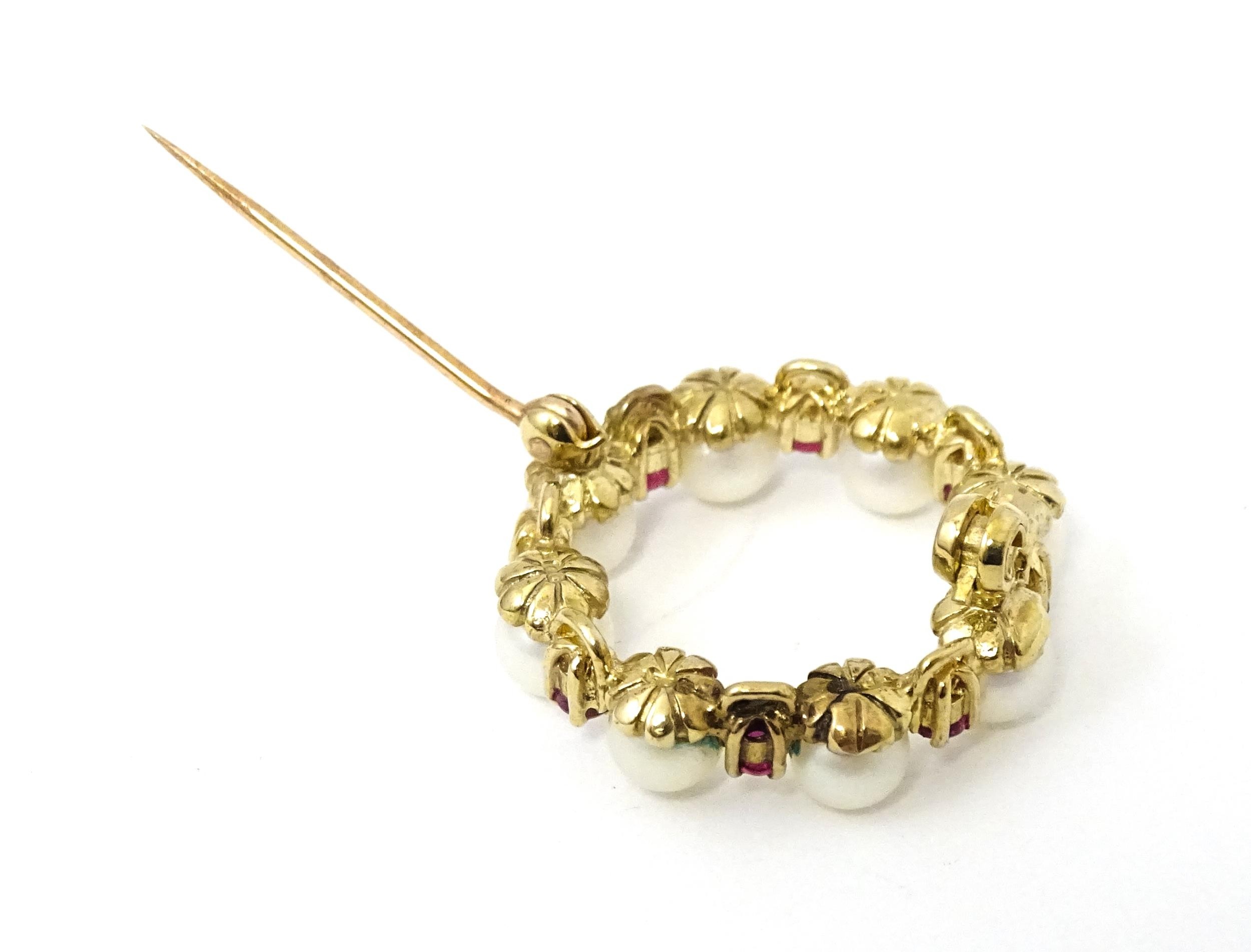 A 9ct gold pendant / brooch of circular set with pearls and round cut rubies. Approx 1" wide - Image 7 of 9