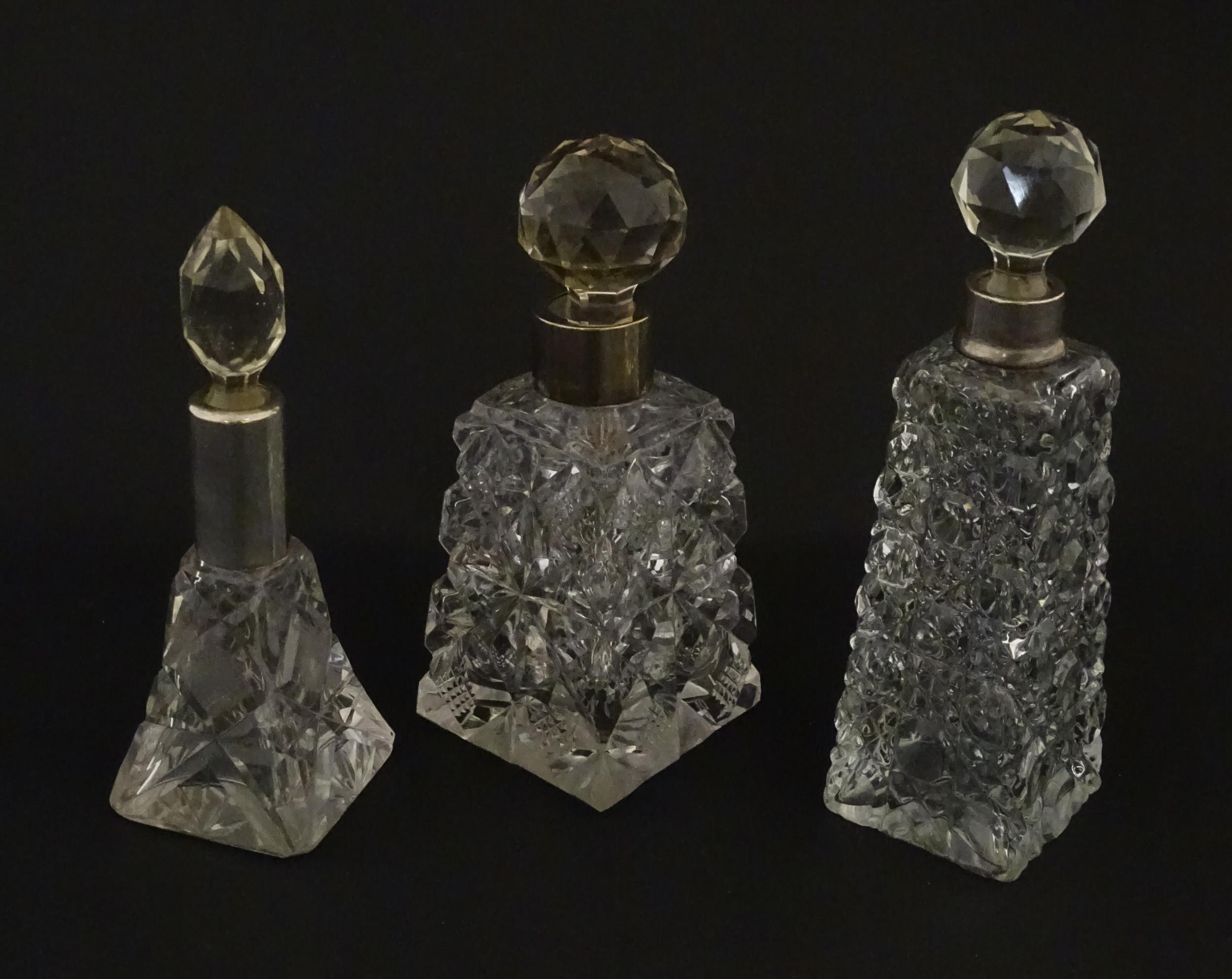 Three assorted cut glass scent / perfume bottles with silver mounts, to include one hallmarked - Image 6 of 10