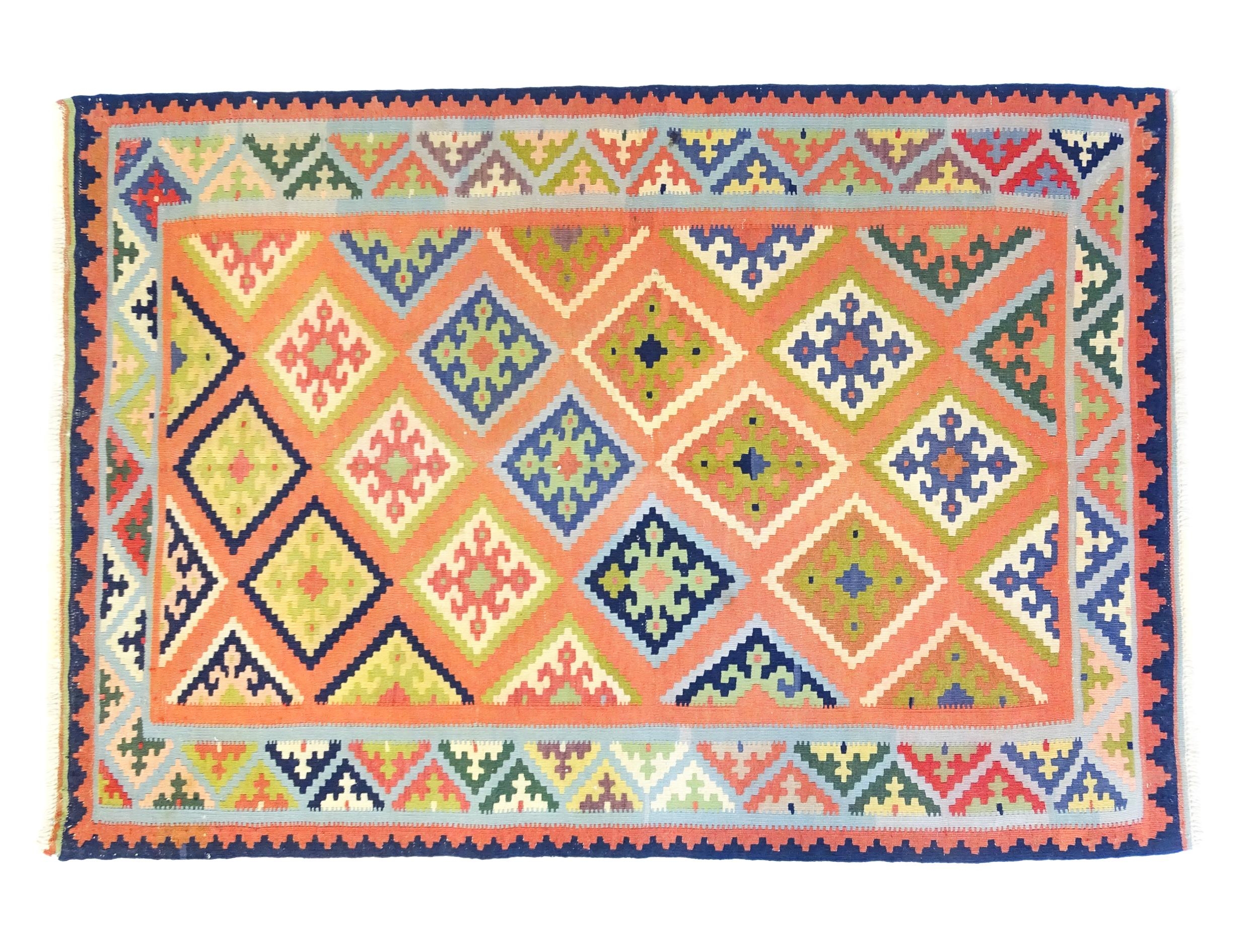 Carpet / Rug : A South West Persian qashgai kilim rug, the salmon ground with repeating geometric