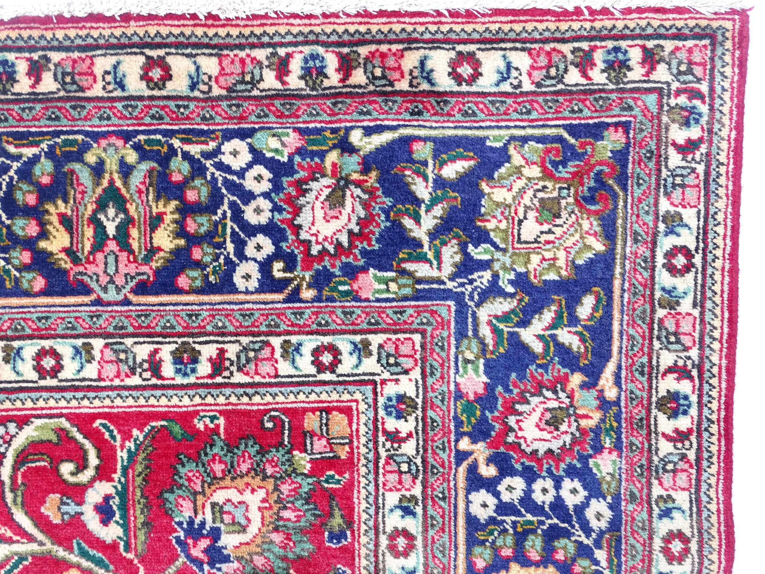 Carpet / Rug: A North West Persian Tabriz carpet the red ground with central cream and blue - Image 4 of 11