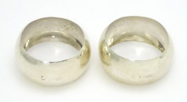 A pair of silver napkin rings hallmarked Birmingham 1910, maker John Sherwood & Sons. (2) Please