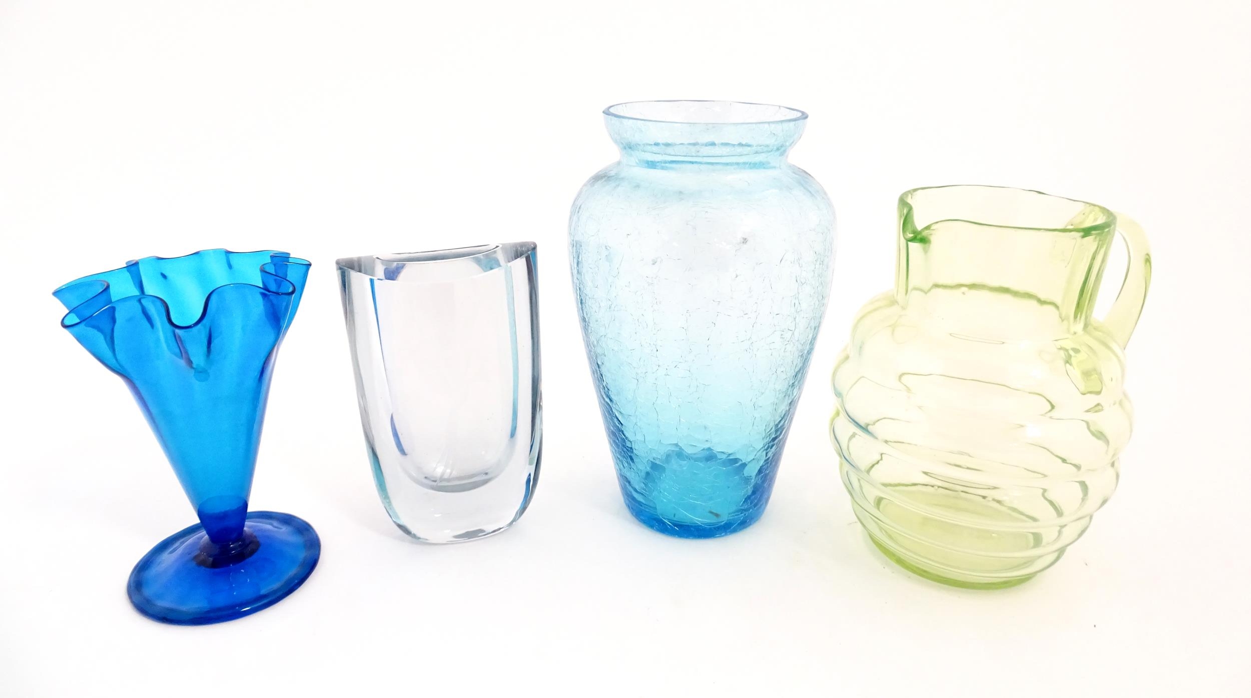 Four items of 20thC glassware to include a Uranium jug, a blue ice glass vase, a Swedish vase by